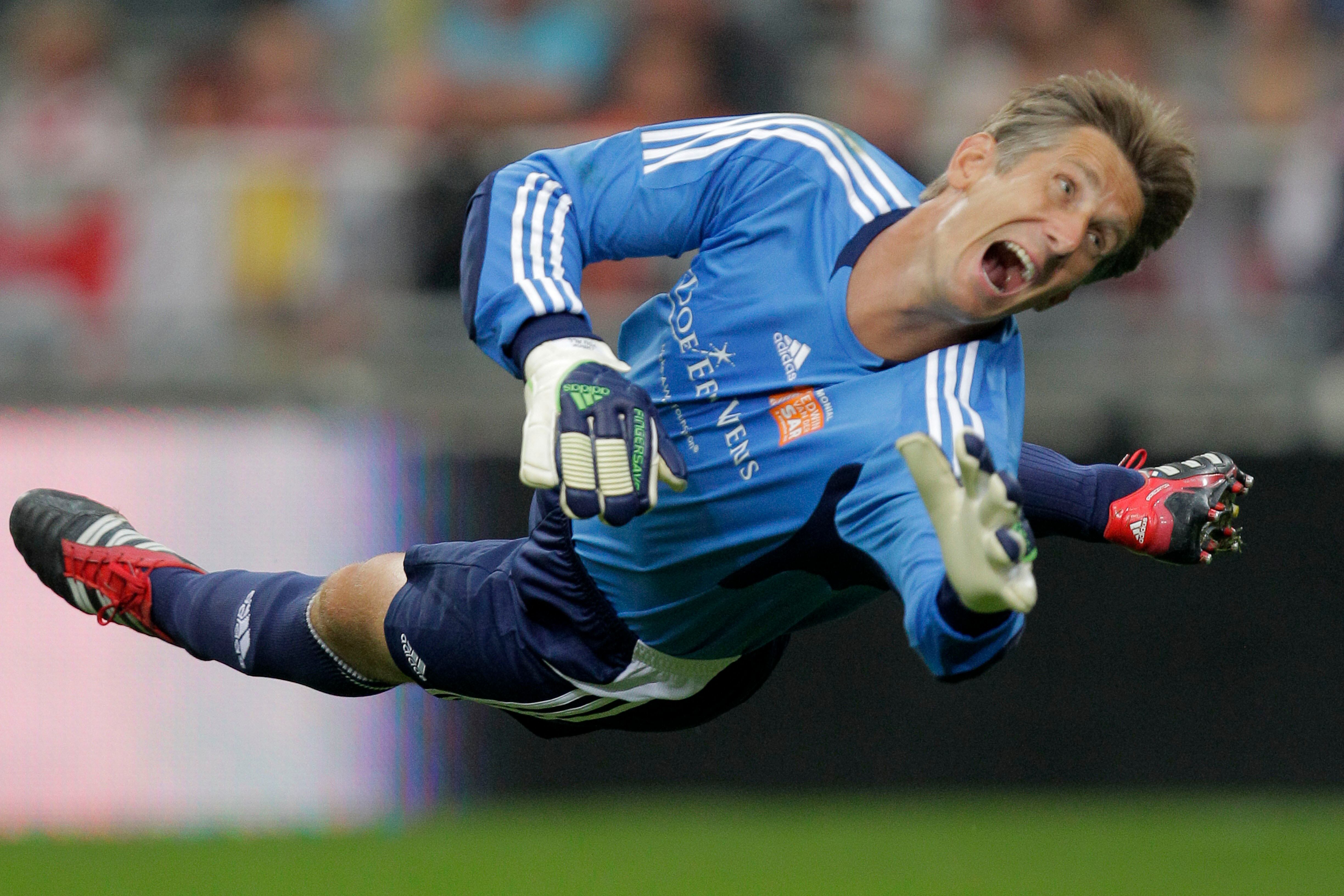 FILE - Former Manchester United goalkeeper Edwin van der Sar watches the ball as he saves on an attempt to score during his farewell tribute match at Amsterdam's ArenA stadium on Aug. 3, 2011. Former Netherlands and Manchester United goalkeeper Edwin van der Sar is in intensive care in a hospital after suffering a bleed in his brain, his former club Ajax said Friday, July 7, 2023. (AP Photo/Peter Dejong, File)