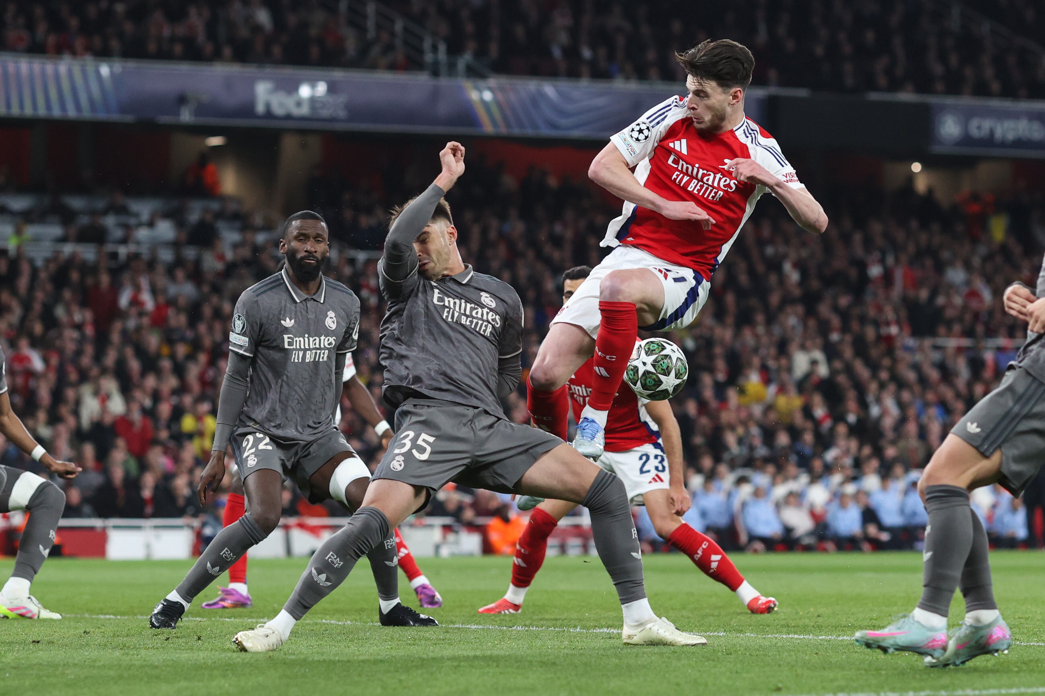 LONDON, ENGLAND - APRIL 8: Declan Rice of Arsenal kicks the ball into the arm of Raul Asencio of Real Madrid resulting in a lengthy VAR check during the UEFA Champions League 2024/25 Quarter Final First Leg match between Arsenal FC and Real Madrid C.F. at Arsenal Stadium on April 8, 2025 in London, England. (Photo by Charlotte Wilson/Offside/Offside via Getty Images)