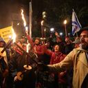Israeli protesters attend a rally against Prime Minister Benjamin Netanyahu's new hard-right government near the Israeli prime minister's residence in Jerusalem on February 9, 2023. (Photo by AHMAD GHARABLI / AFP)