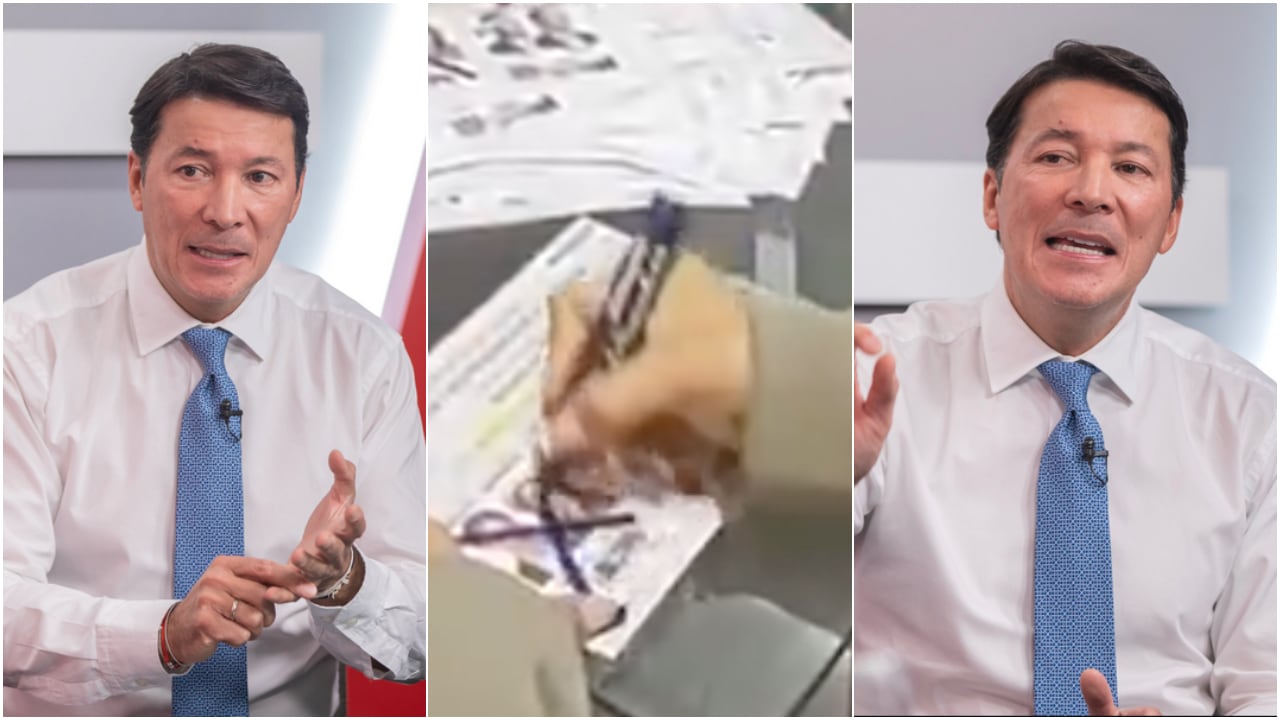 Hernán Penagos Giraldo, registrador nacional del Estado Civil, el 18 de junio de 2026, en Bogotá. En el centro, la imagen del video sobre votos marcados, que suscitó controversia.