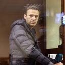 This screen grab from a handout footage provided by the Babushkinsky district court on February 5, 2021, shows Russian opposition leader Alexei Navalny, charged with defaming a World War II veteran, looking from inside a glass cell during a court hearing in Moscow. (Photo by Handout / Moscow's Babushkinsky district court press service / AFP) / RESTRICTED TO EDITORIAL USE - MANDATORY CREDIT "AFP PHOTO / Moscow's Babushkinsky district court press service / handout " - NO MARKETING - NO ADVERTISING CAMPAIGNS - DISTRIBUTED AS A SERVICE TO CLIENTS