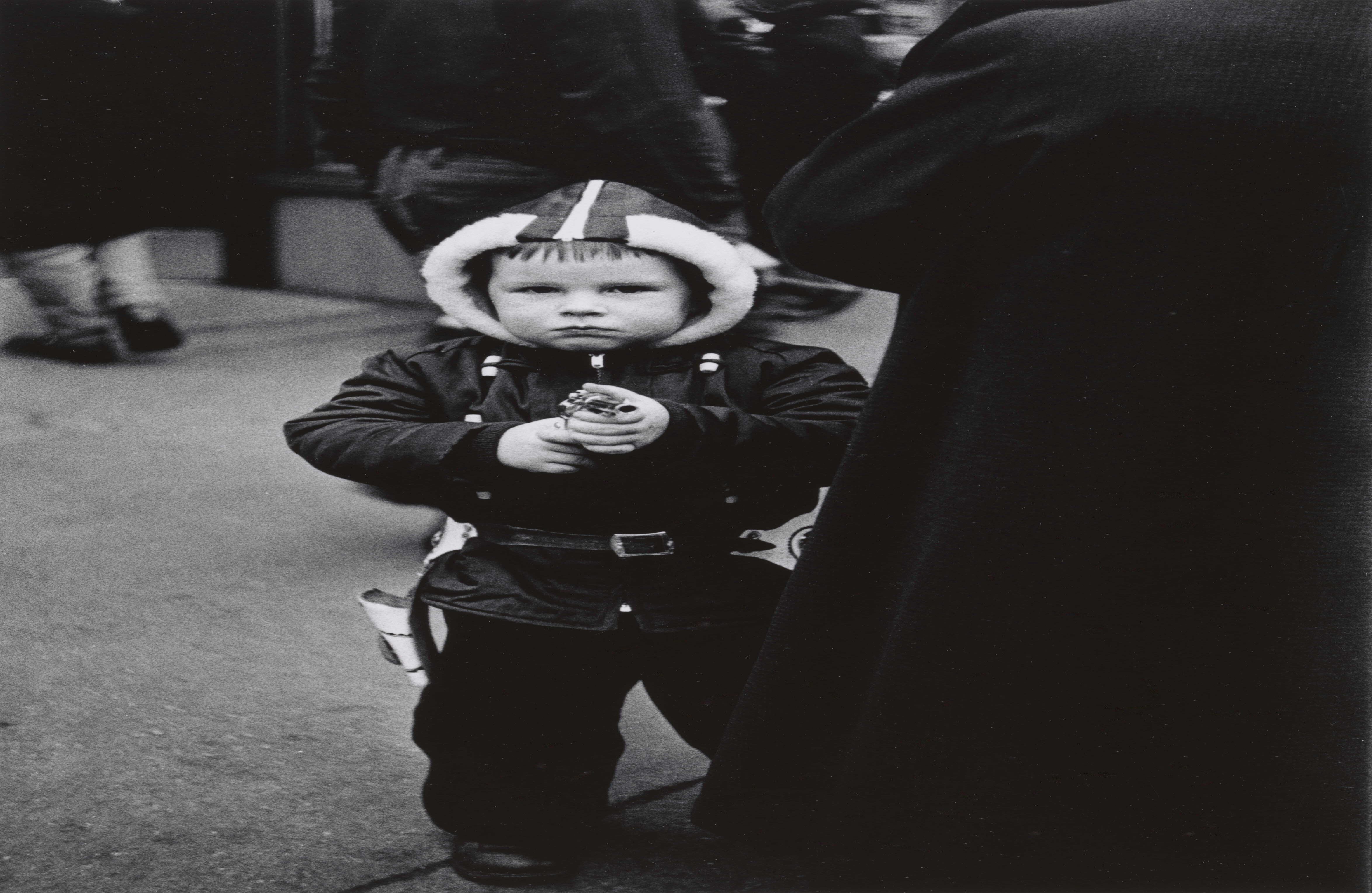 Kid in a hooded jacket aiming a gun, N.Y.C. 1957. © The Estate of Diane Arbus, LLC. All Rights Reserved.