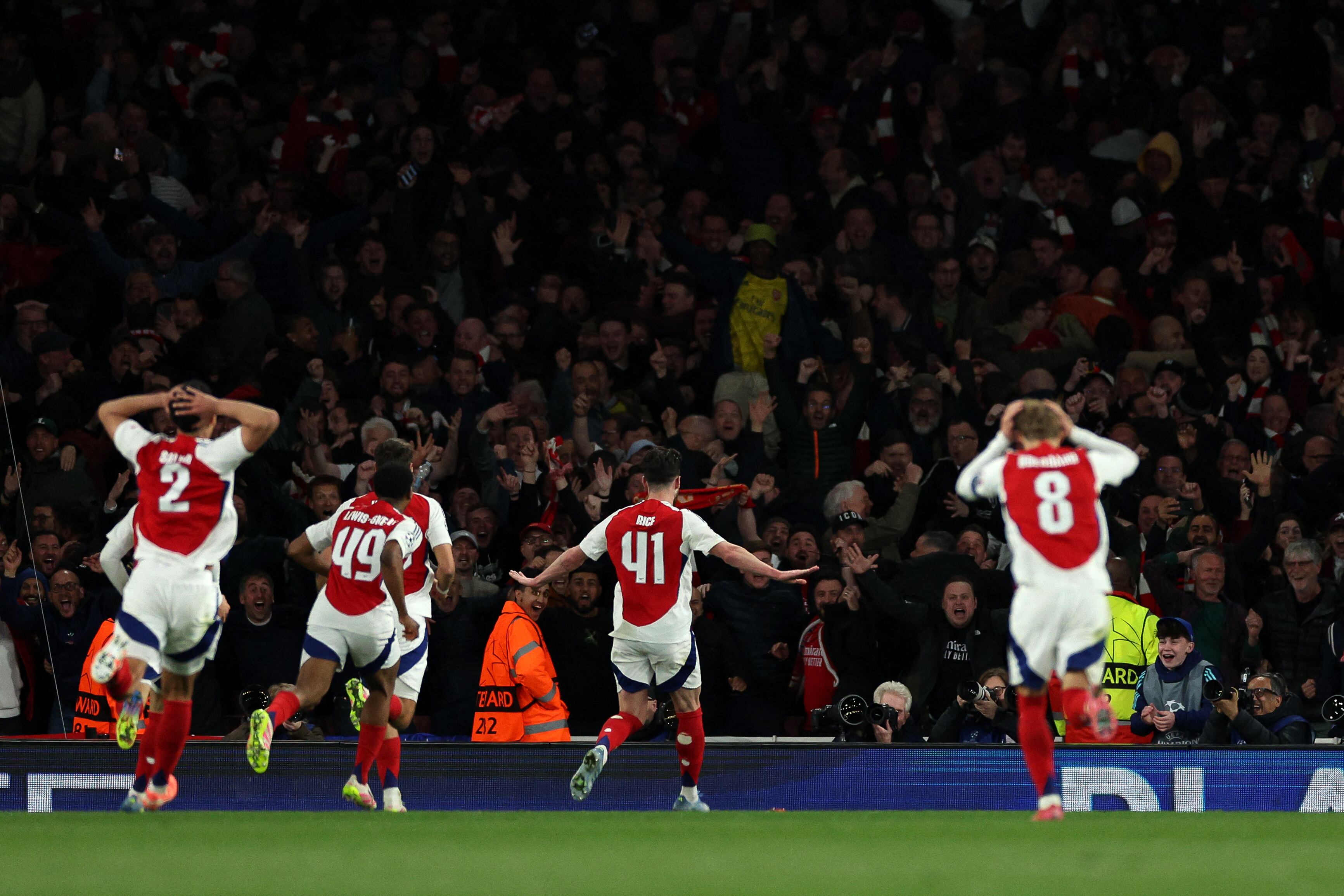 Arsenal's English midfielder #41 Declan Rice celebrates scoring the team's second goal during the UEFA Champions League Quarter final first leg football match between Arsenal and Real Madrid, at the Emirates Stadium, in London, on April 8, 2025. (Photo by Adrian Dennis / AFP)