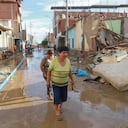 Residents walk among devastated neigborhoods and homes of the semi rural district of Illimo in the Piura region in northern Peru, on March 11, 2023, after heavy rains caused by the presence of an "unorganized cyclone� named Yaku, off the Peruvian coast, in the waters of the Pacific Ocean, according to the authorities. - The floods, accompanied by strong winds that affect part of Peru, started this week and grew in proportions in the last 48 hours, affecting urban and rural areas of the coastal departments of La Libertad, Lambayeque, Piura and Tumbes, on the border with Ecuador. "Cyclone Yaku is a very unusual phenomenon causing intensifying rains in the north," said the director of Civil Defense, C�sar Sierra. The the cyclone is located some 500 kilometers west from the Peruvian coast, according to the Peruvian Meteorological Service (Senahmi). (Photo by Jao Yamunaque / AFP)