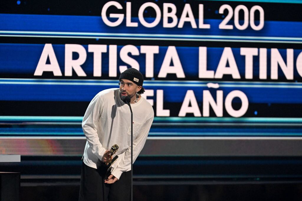 CORAL GABLES, FLORIDA - OCTOBER 05: Bad Bunny accepts an award onstage during the 2023 Billboard Latin Music Awards at Watsco Center on October 05, 2023 in Coral Gables, Florida. (Photo by Jason Koerner/Getty Images)