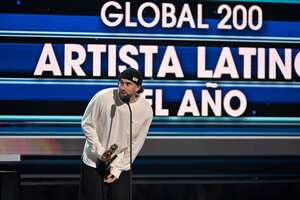 CORAL GABLES, FLORIDA - OCTOBER 05: Bad Bunny accepts an award onstage during the 2023 Billboard Latin Music Awards at Watsco Center on October 05, 2023 in Coral Gables, Florida. (Photo by Jason Koerner/Getty Images)