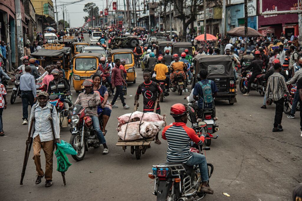 GOMA, DEMOCRATIC REPUBLIC OF CONGO - JANUARY 31: Civilian drivers and pedestrians travel down a street as M23 rebels retained control of the city on January 31, 2025 in Goma, Democratic Republic of Congo.  The Rwanda-backed M23 rebel group has seized control of Goma, in Eastern Congo, and are reportedly advancing south. (Photo by Daniel Buuma/Getty Images)
