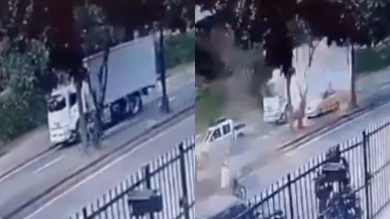 Al fondo de la imagen, el carro bomba en Cali.