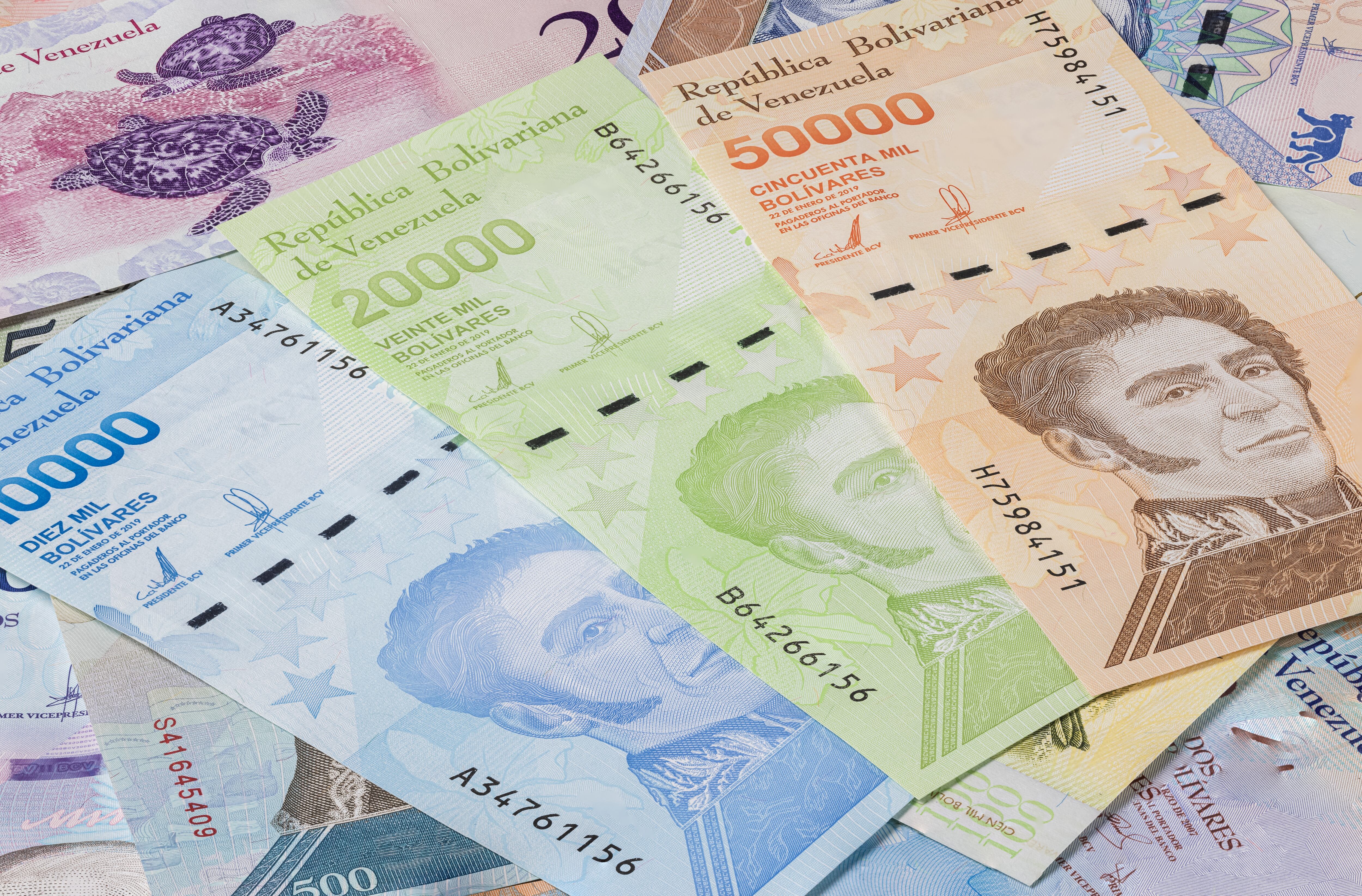 Bolivares or Bolivar money of the republic Venezuela. Close up to the currency of the south American country Venezuela. High inflation and weak economy increases the denomination of the banknotes.