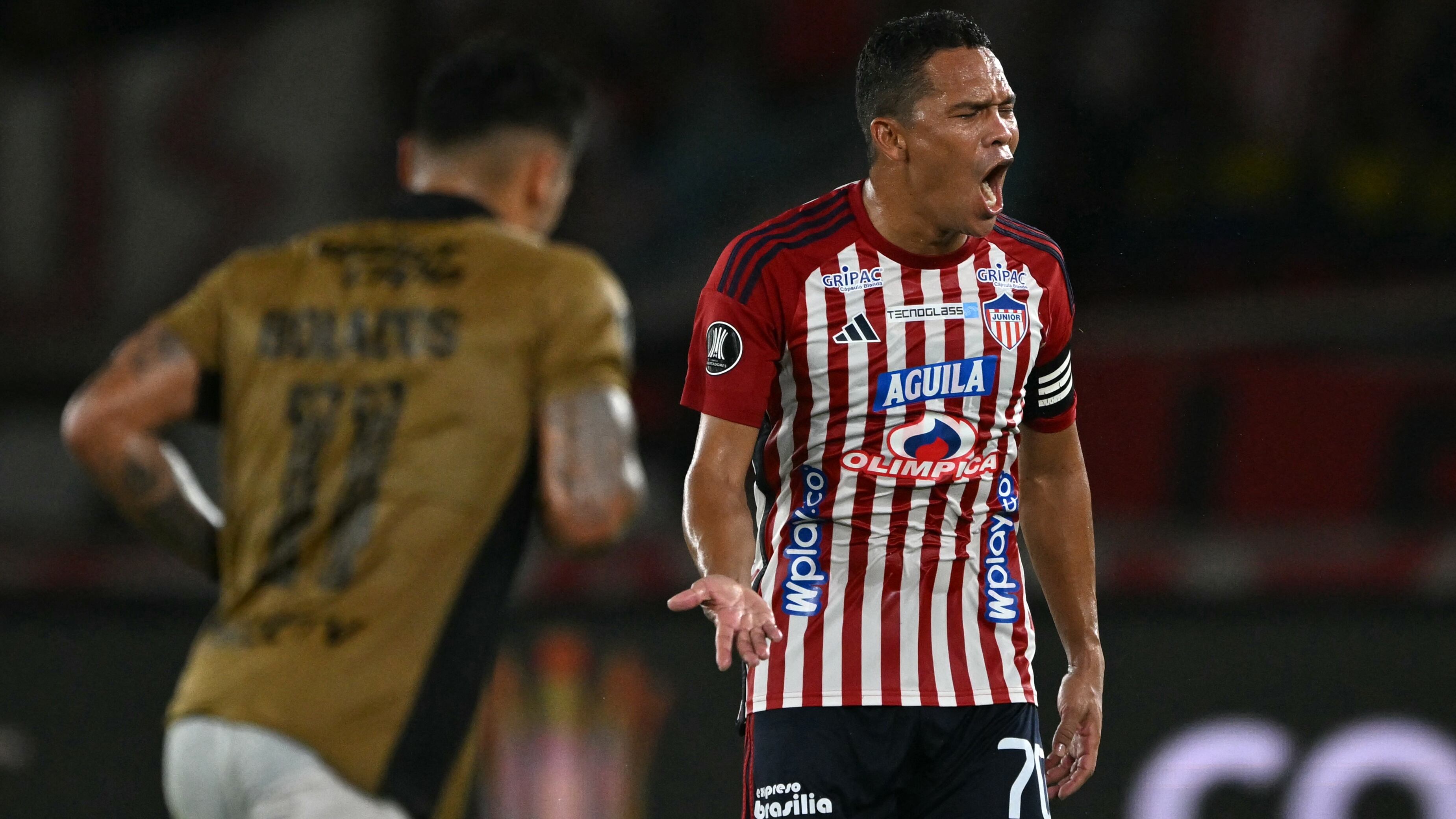Junior's forward Carlos Bacca celebrates after scoring during the Copa Libertadores round of 16 second leg football match between Colombia's Junior and Chile's Colo Colo at the Metropolitano Roberto Melendez stadium in Barranquilla, Colombia, on August 20, 2024. (Photo by Luis ACOSTA / AFP)