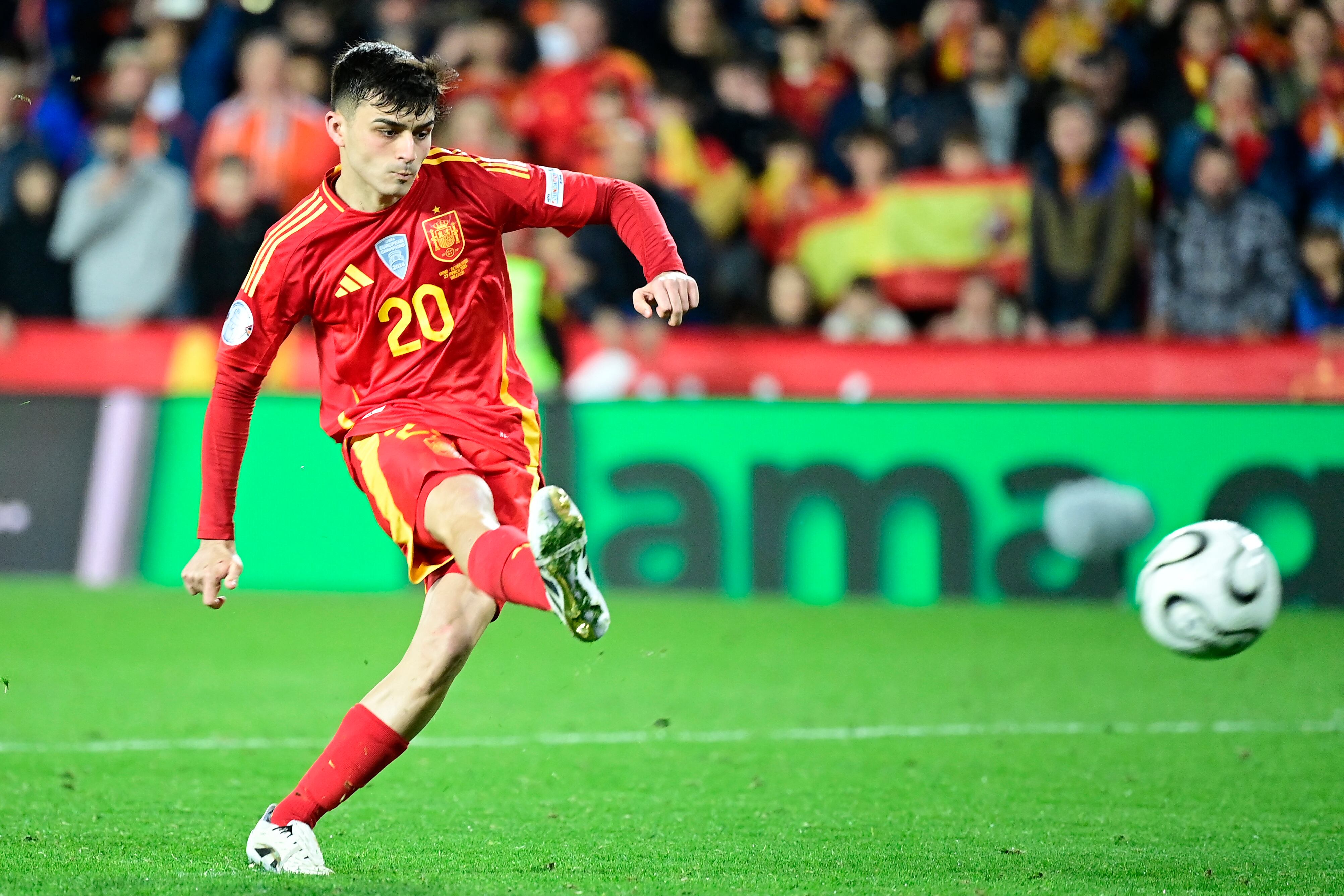 Spain's midfielder #20 Pedri shoots during the penalty shoot out during the UEFA Nations League quarter final second leg football match between  Spain and Netherlands at the Mestalla stadium in Valencia, on March 23, 2025. (Photo by JOSE JORDAN / AFP)