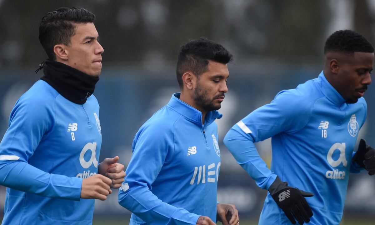 From L) FC Porto's Colombian midfielder Mateus Uribe, FC Porto's Mexican forward Jesus Corona and FC Porto's Portuguese midfielder Wilson Manafa take part in a training session at the FC Porto's Olival training ground, in Vila Nova de Gaia near Porto, on December 6, 2021, on the eve of the UEFA Champions League, Group B, football match against Atletico Madrid.