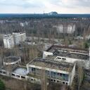 A view of the ghost town of Pripyat with a shelter covering the exploded reactor at the Chernobyl nuclear plant in the background, Ukraine, Thursday, April 15, 2021. The vast and empty Chernobyl Exclusion Zone around the site of the world’s worst nuclear accident is a baleful monument to human mistakes. Yet 35 years after a power plant reactor exploded, Ukrainians also look to it for inspiration, solace and income. (AP Photo/Efrem Lukatsky)