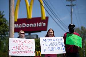 ELIZABETH CITY, NC - APRIL 23: Robin Woodard, left, and Brian Murrey, center, block an intersection in front of a McDonalds during a protest march April 23, 2021 in Elizabeth City, North Carolina. Protestors gathered before elected officials discussed the possible release of police body camera footage from the shooting death of Andrew Brown Jr. on April 21. Sean Rayford/Getty Images/AFP (Photo by Sean Rayford / GETTY IMAGES NORTH AMERICA / Getty Images via AFP)
