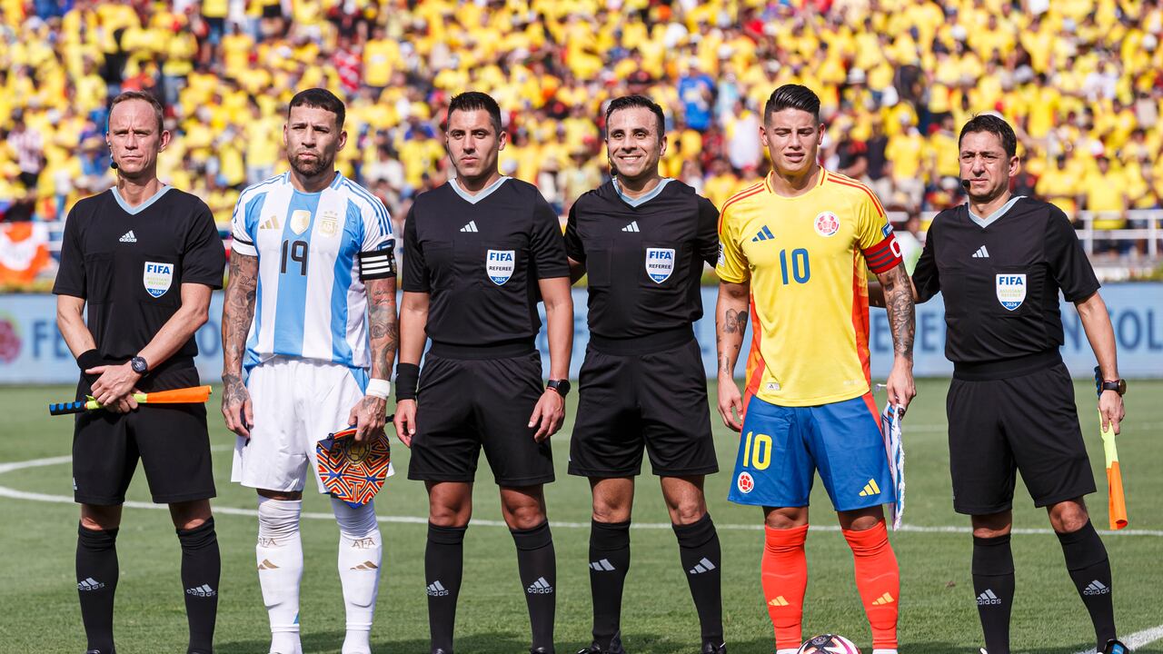 BARRANQUILLA, COLOMBIA - SEPTEMBER 10: Nicolas Otamendi of Argentina (L) and James Rodriguez of Colombia (R) poses for official photo with referees during the FIFA World Cup 2026 Qualifier match between Colombia and Argentina at Roberto Melendez Metropolitan Stadium on September 10, 2024 in Barranquilla, Colombia. (Photo by Martín Fonseca/Eurasia Sport Images/Getty Images)