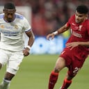 Real Madrid's David Alaba, left, is challenged by Liverpool's Luis Diaz during the Champions League final soccer match between Liverpool and Real Madrid at the Stade de France in Saint Denis near Paris, Saturday, May 28, 2022. (AP Photo/Kirsty Wigglesworth)