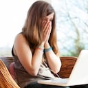 Teenage girl with hands on face victim of cyber bullying