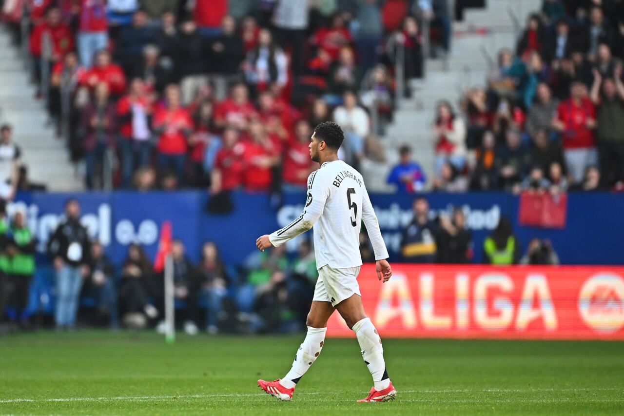 Real Madrid's Jude Bellingham walks off the pitch after he received a red card during a Spanish La Liga soccer match between Osasuna and Real Madrid at El Sardar stadium in Pamplona, Spain, Saturday, Feb. 15, 2025. (AP Photo/Miguel Oses)
