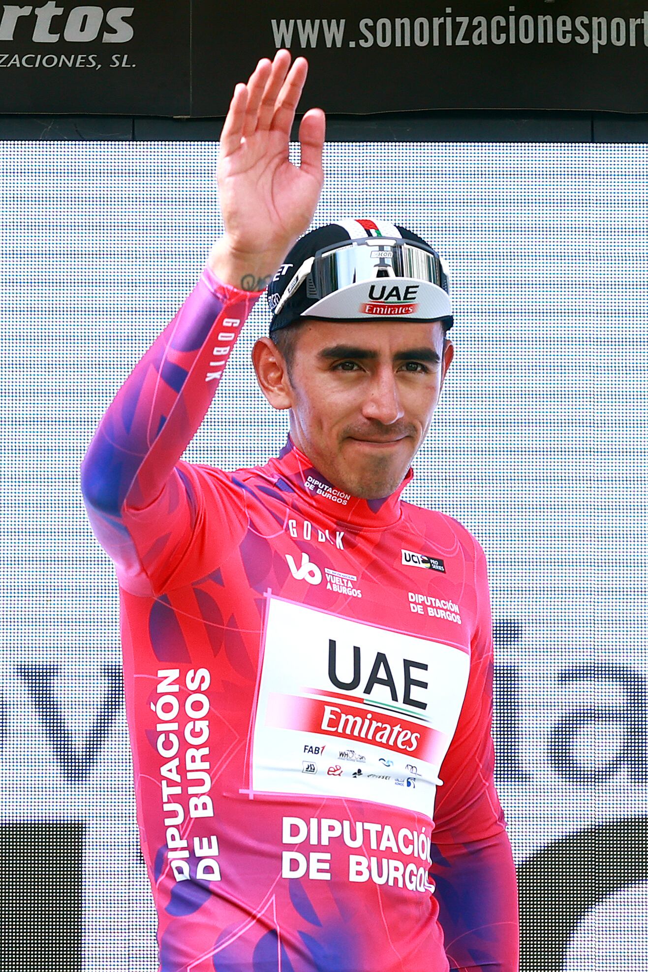 BURGOS, SPAIN - AUGUST 15: (EDITOR'S NOTE: Alternate crop) Juan Sebastian Molano Benavides of Colombia and UAE Team Emirates celebrates at podium as during the 45th Vuelta a Burgos 2023, Stage 1 a 161km stage from Villalba de Duero to Burgos on August 15, 2023 in Burgos, Spain. (Photo by Gonzalo Arroyo Moreno/Getty Images)
