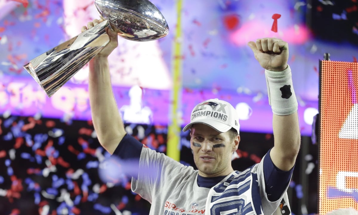 FILE - New England Patriots quarterback Tom Brady celebrates with the Vince Lombardi Trophy after the NFL Super Bowl XLIX football game against the Seattle Seahawks Sunday, Feb. 1, 2015, in Glendale, Ariz. The Patriots won 28-24. Tom Brady has retired after winning seven Super Bowls and setting numerous passing records in an unprecedented 22-year-career. He made the announcement, Tuesday, Feb. 1, 2022, in a long post on Instagram. (AP/Michael Conroy, File)