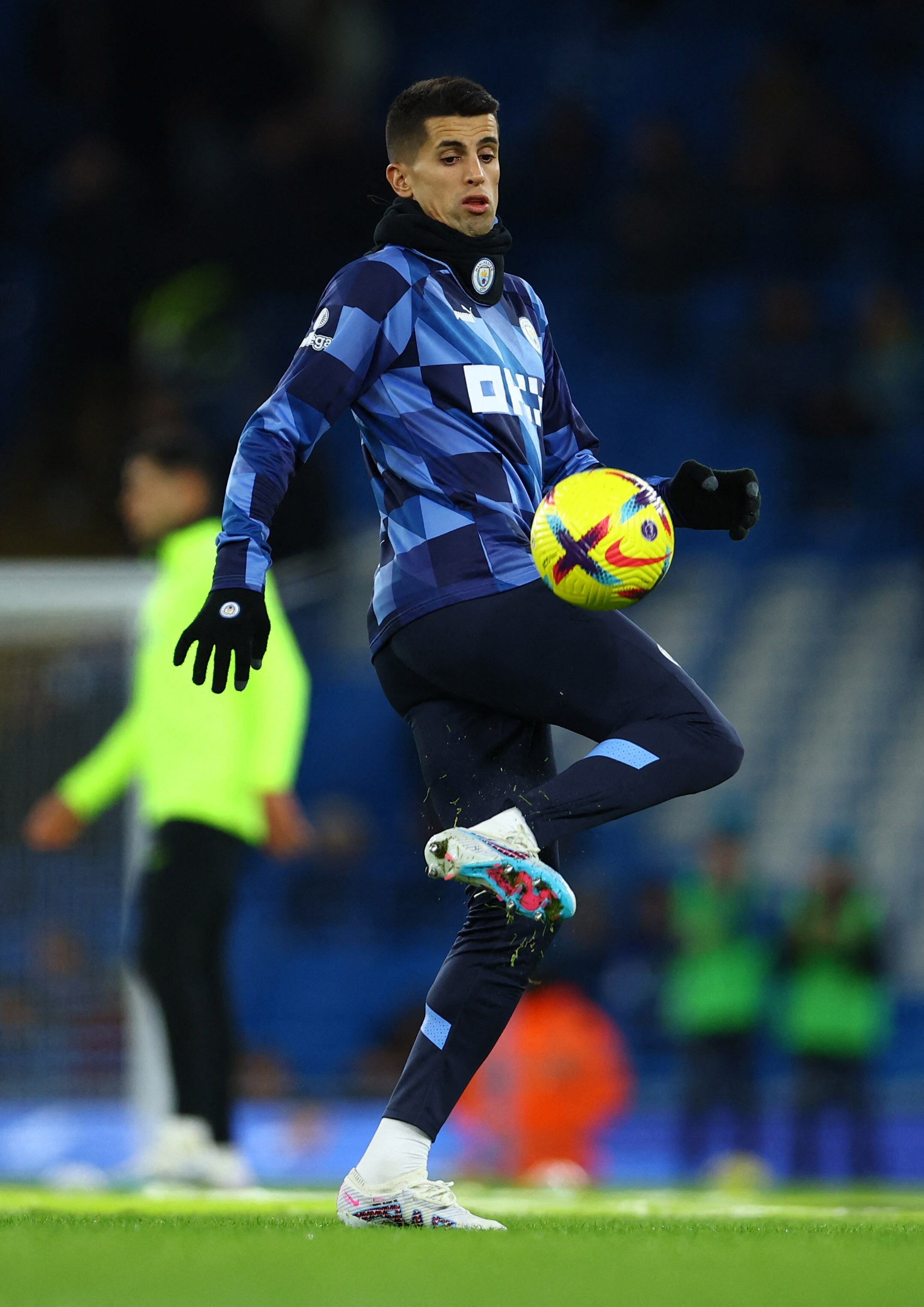 Soccer Football - Premier League - Manchester City v Tottenham Hotspur - Etihad Stadium, Manchester, Britain - January 19, 2023 Manchester City's Joao Cancelo during the warm up before the match REUTERS/Molly Darlington EDITORIAL USE ONLY. No use with unauthorized audio, video, data, fixture lists, club/league logos or 'live' services. Online in-match use limited to 75 images, no video emulation. No use in betting, games or single club /league/player publications.  Please contact your account representative for further deta