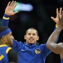 Golden State Warriors forward Juan Toscano-Anderson (95) high fives forward Draymond Green (23) and guard Gary Payton II (0) during the second quarter of Game 6 of basketball's NBA Finals against the Boston Celtics, Thursday, June 16, 2022, in Boston. (AP Photo/Steven Senne)