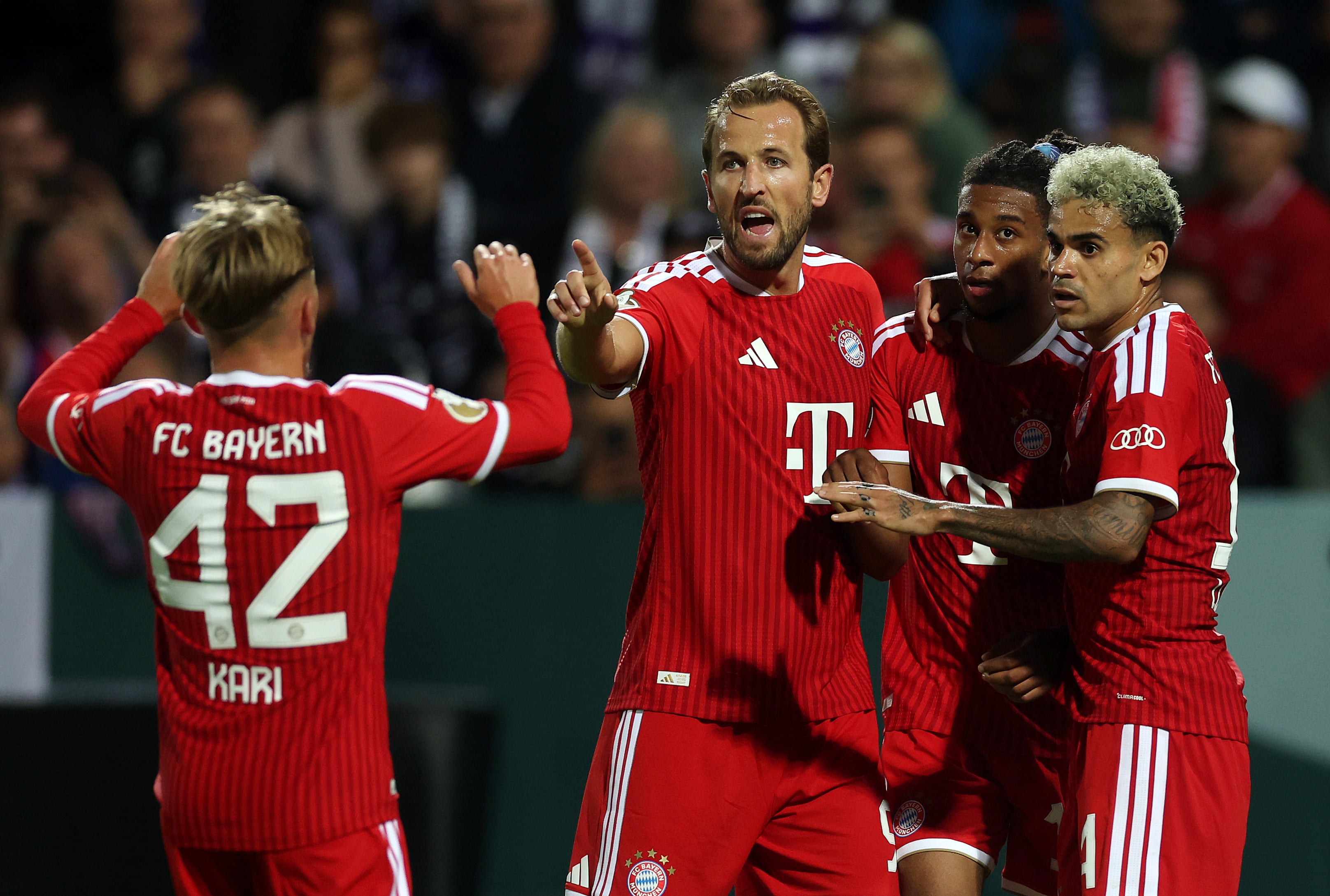 OSNABRUECK, GERMANY - SEPTEMBER 02: Michael Olise of Bayern Munich celebrates scoring his team’s third goal with teammates Lennart Karl, Harry Kane and Luis Diaz  during the DFB Cup 2026/27 first round match between VfL Osnabrück and FC Bayern München at Stadion an der Bremer Brücke on September 02, 2026 in Osnabrueck, Germany. (Photo by Lars Baron/Getty Images)
