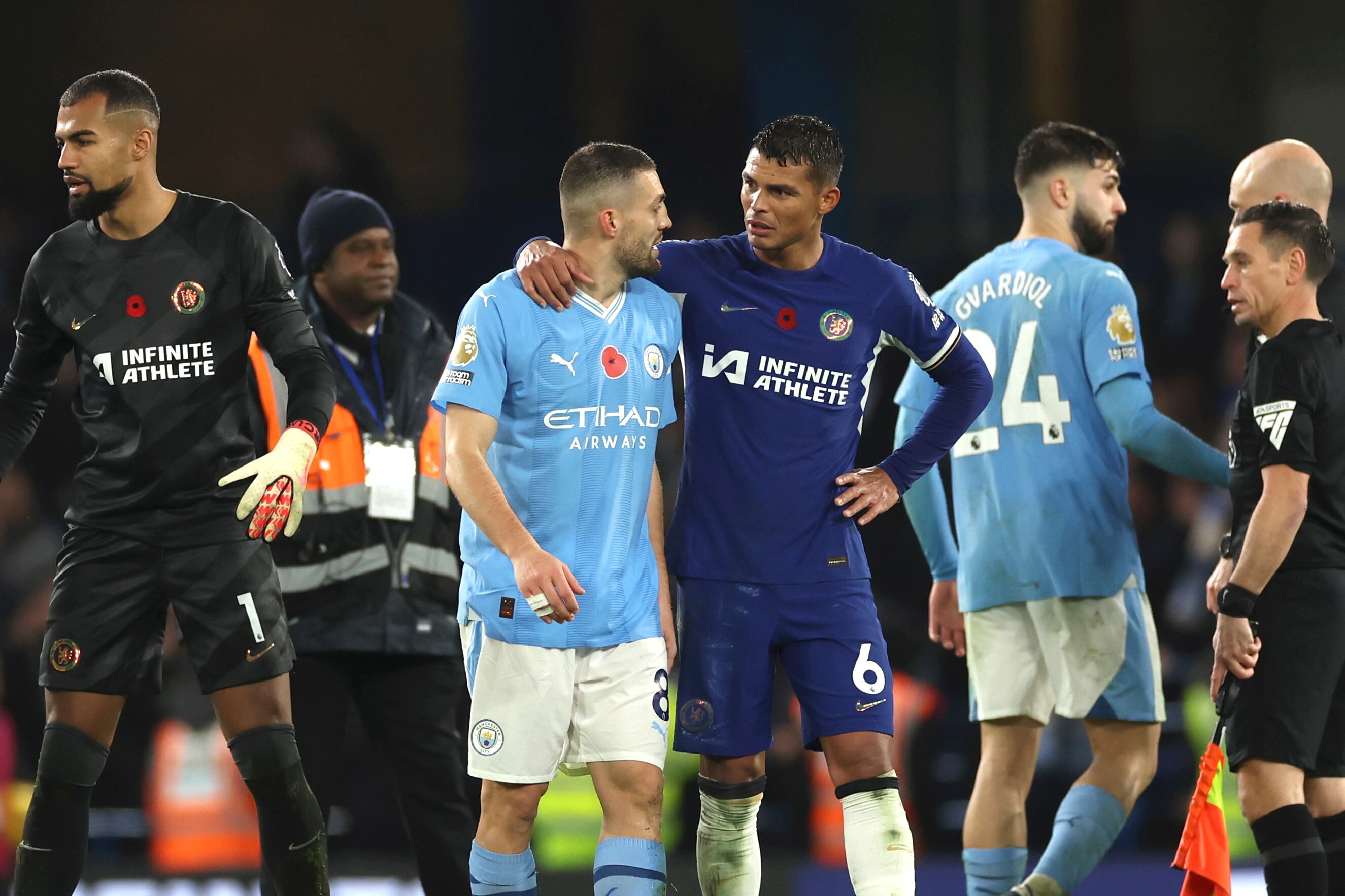 Chelsea's Thiago Silva leaves the field with Manchester City's Mateo Kovacic at the end of the English Premier League soccer match between Chelsea and Manchester City at Stamford Bridge stadium in London, Sunday, Nov. 12, 2023. (AP Photo/Ian Walton)