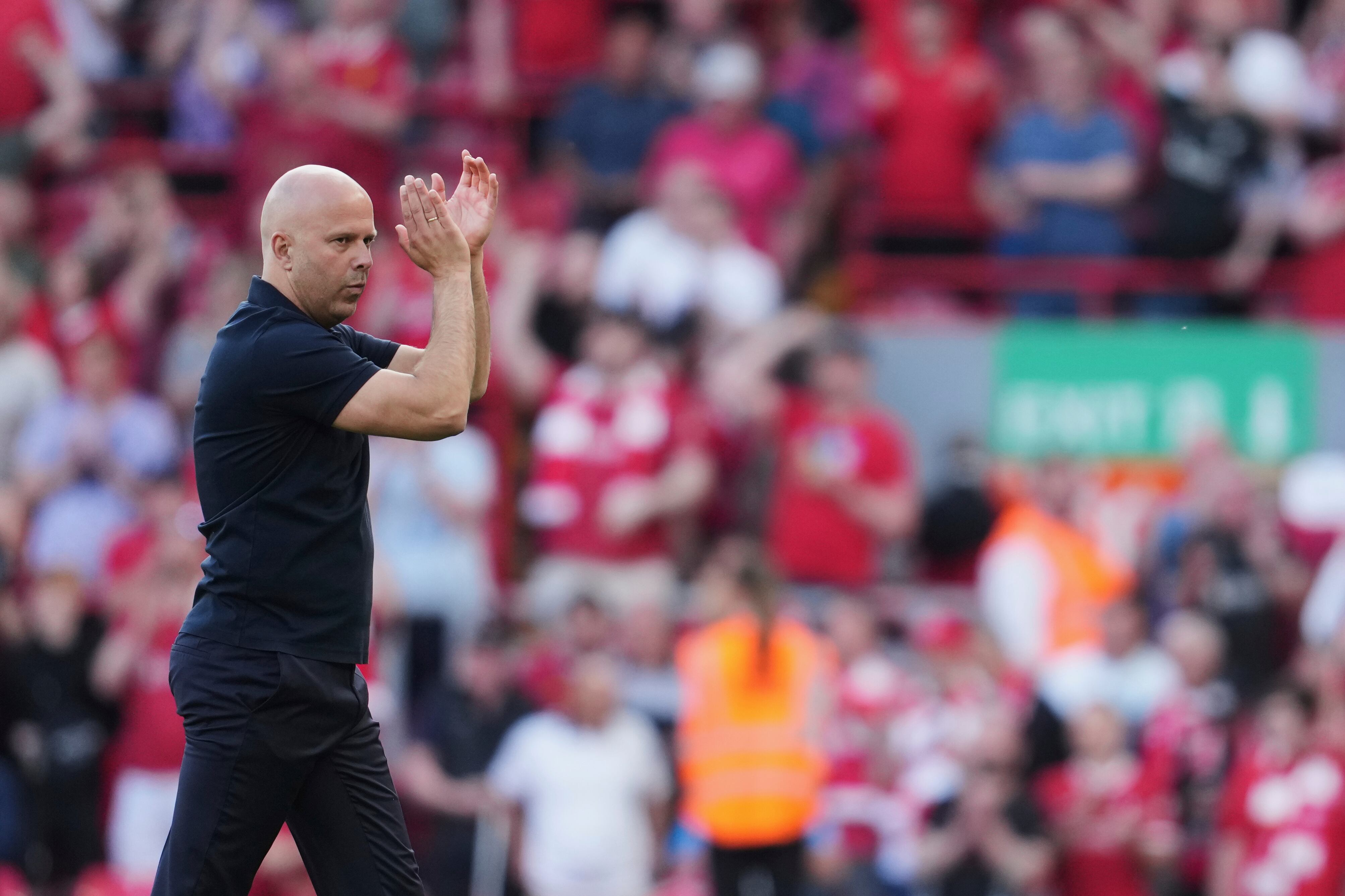 Liverpool's manager Arne Slot applauds to supporters at the end of the English Premier League soccer match between Liverpool and Arsenal, at Anfield stadium in Liverpool, England, Sunday, May 11, 2025. (AP Photo/Jon Super)