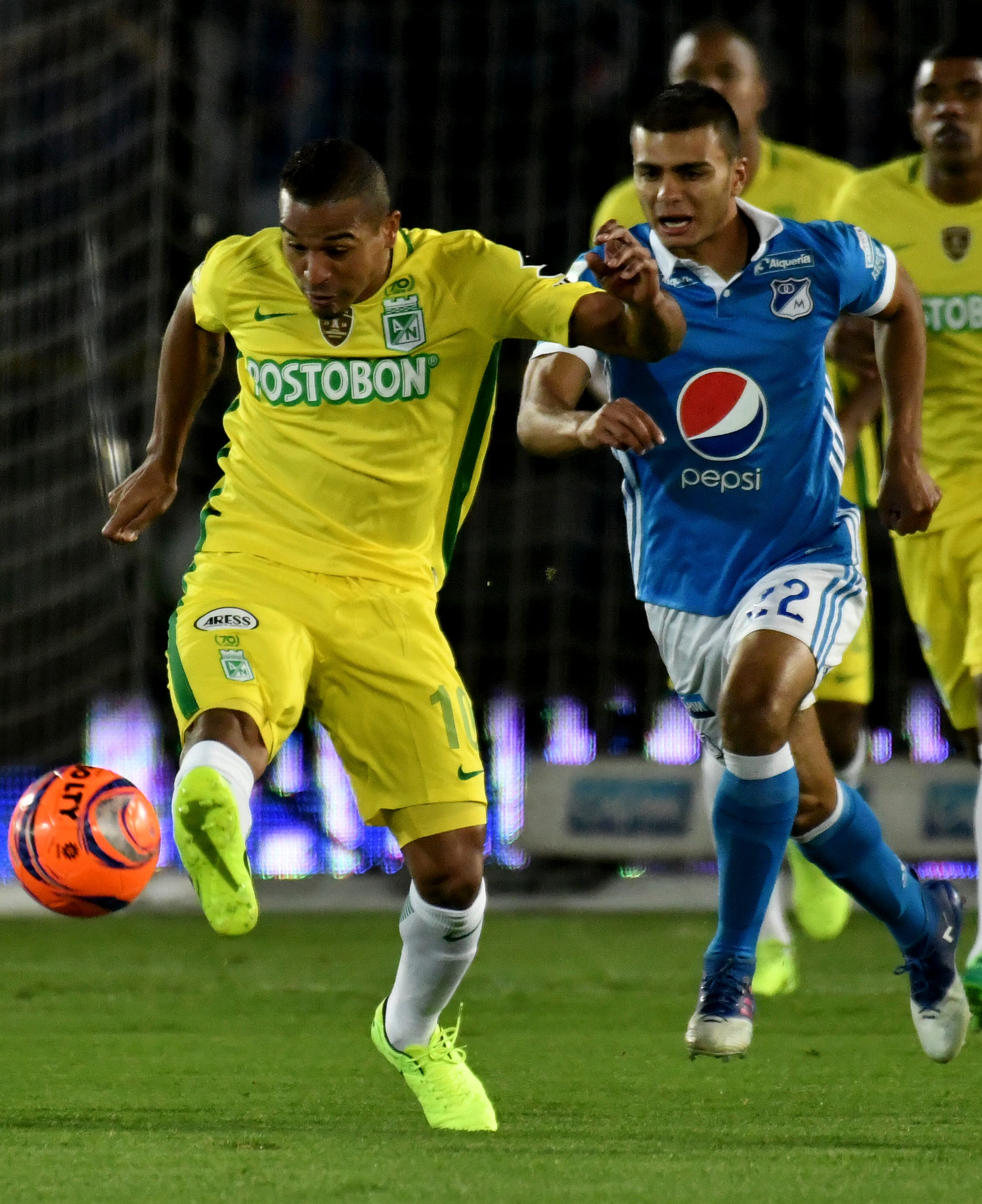BOGOTA, COLOMBIA - APRIL 07:  John Duque (R) of Millonarios vies for the ball with Macnelly Torres (L) of Atletico Nacional during the match between Millonarios and Atletico Nacional as part of the Liga Aguila I 2017 at Nemesio Camacho El Campin Stadium on April 07, 2017 in Bogota, Colombia. (Photo by Luis Ramirez/VizzorImage/LatinContent via Getty Images)