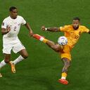 Soccer Football - FIFA World Cup Qatar 2022 - Group A - Netherlands v Qatar - Al Bayt Stadium, Al Khor, Qatar - November 29, 2022 Netherlands' Memphis Depay in action with Qatar's Pedro Miguel REUTERS/Albert Gea