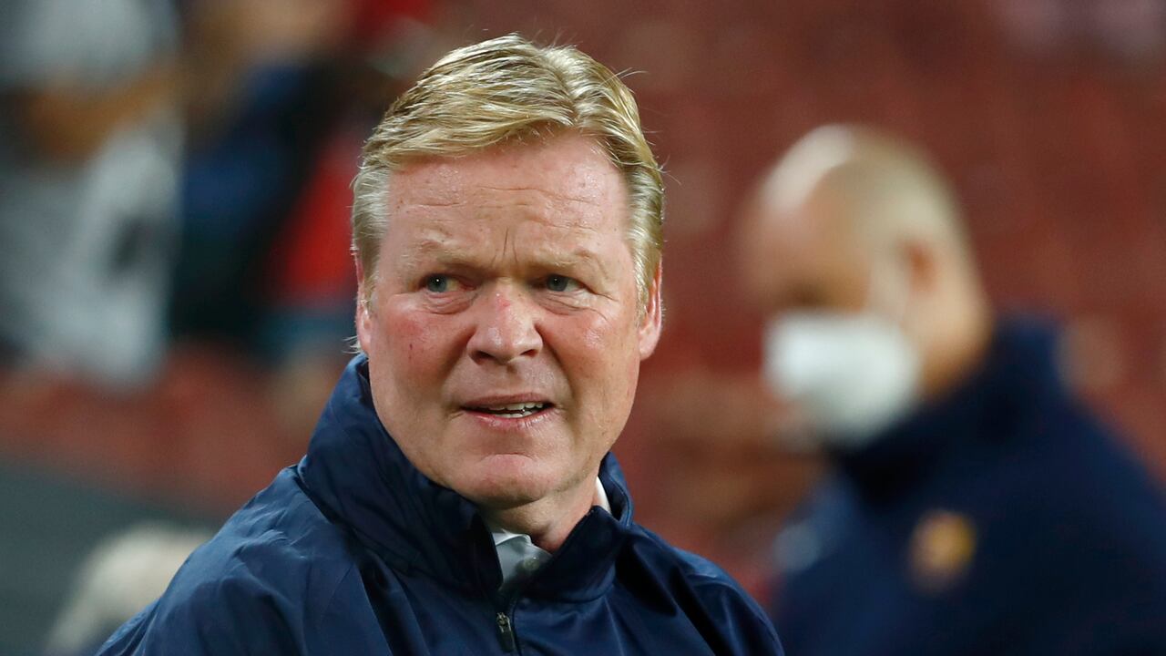 Barcelona's head coach Ronald Koeman grimaces during the Spanish La Liga soccer match between Barcelona and Granada, at the Camp Nou stadium in Barcelona, Spain, Monday, Sept. 20, 2021. (AP Photo/Joan Monfort)