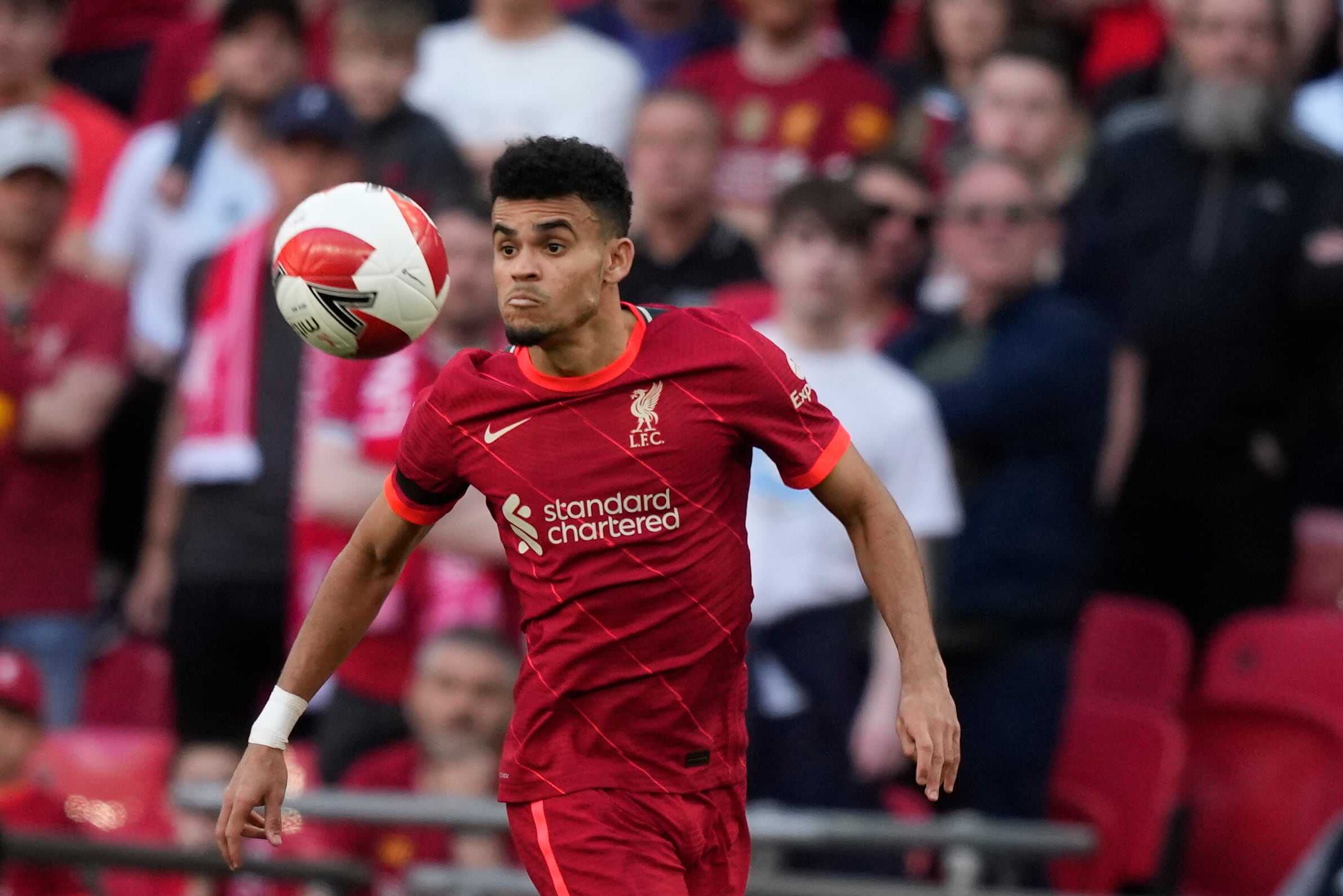 Liverpool's Luis Diaz eyes the ball during the English FA Cup semifinal soccer match between Manchester City and Liverpool at Wembley stadium in London, Saturday, April 16, 2022. (AP Photo/Frank Augstein)