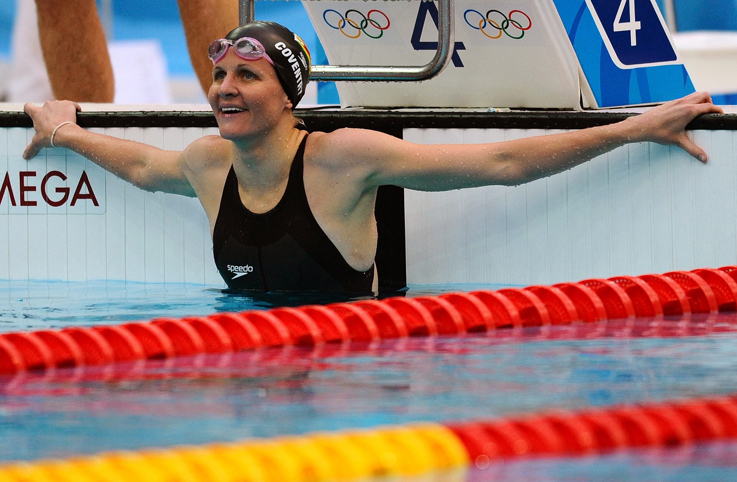 (FILES) Zimbabwe's Kirsty Coventry celebrates after competing in the women's 200m backstroke swimming final, setting a new world record in the women's 200 metres backstroke with a time of two minutes 05.24 seconds at the National Aquatics Center during the 2008 Beijing Olympic Games in Beijing on August 16, 2008. Zimbabwe's Kirsty Coventry was elected president of International Olympic Committee on March 20, 2025. (Photo by Martin BUREAU / AFP)