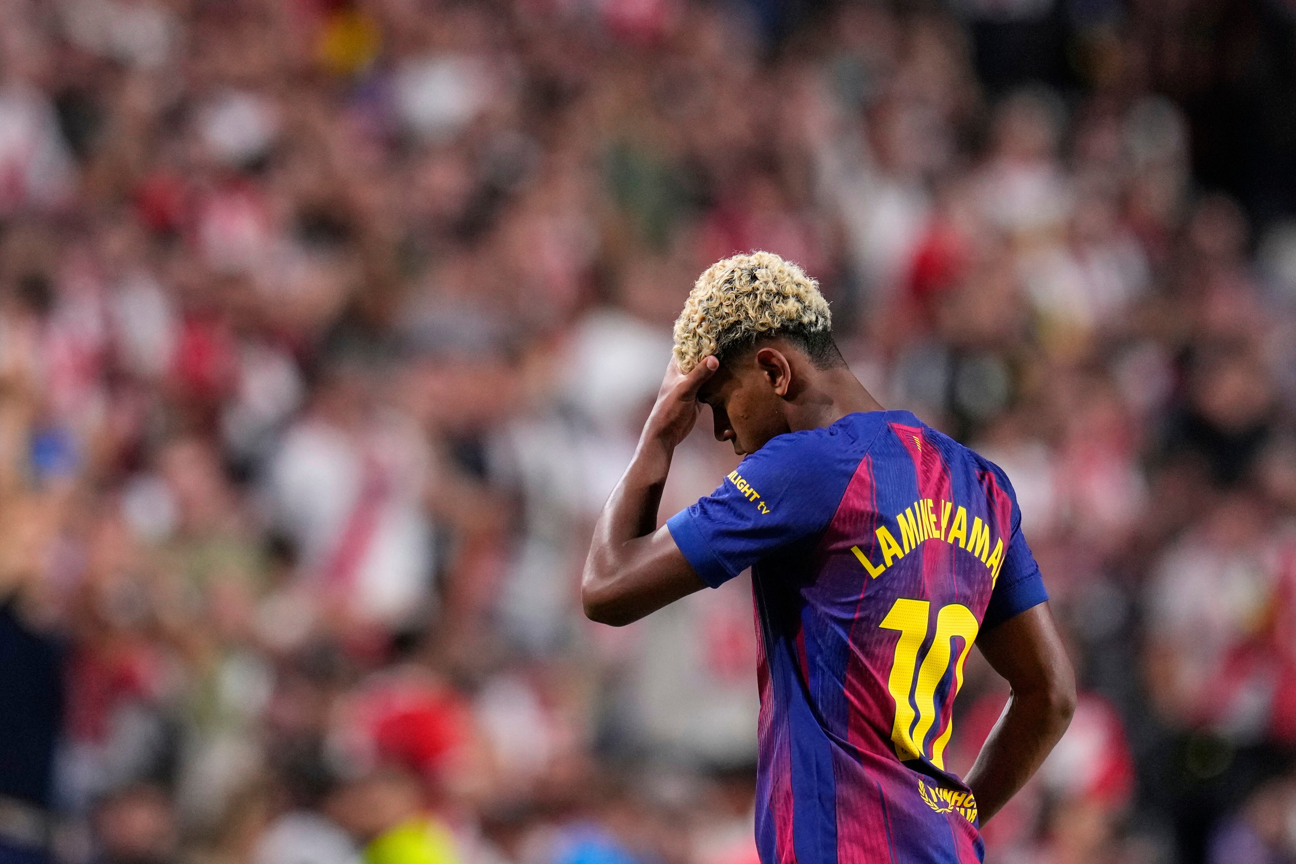Barcelona's Lamine Yamal reacts during the Spanish La Liga soccer match between Rayo Vallecano and FC Barcelona at the Vallecas stadium in Madrid, Spain, Sunday, Aug. 31, 2025. (AP Photo/Manu Fernandez)
