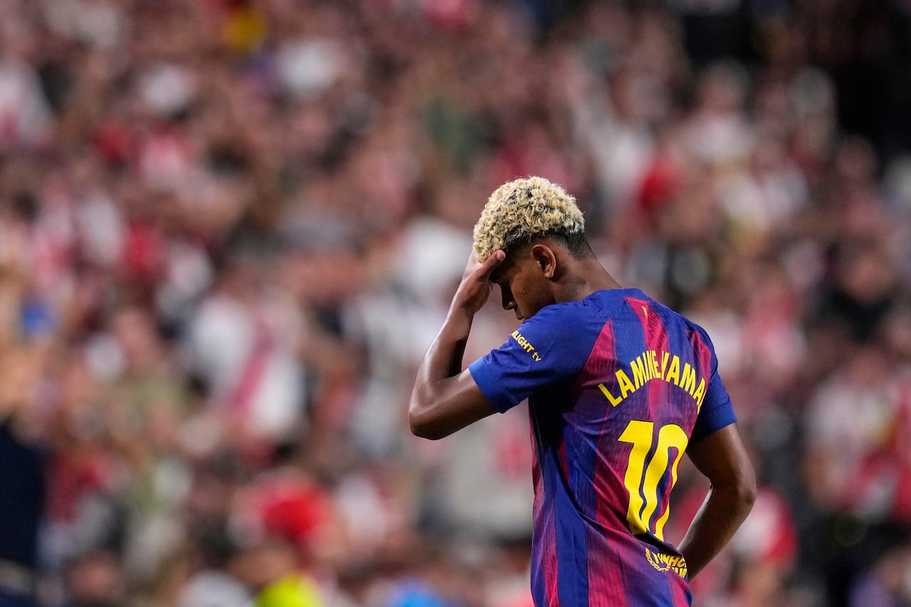 Barcelona's Lamine Yamal reacts during the Spanish La Liga soccer match between Rayo Vallecano and FC Barcelona at the Vallecas stadium in Madrid, Spain, Sunday, Aug. 31, 2025. (AP Photo/Manu Fernandez)
