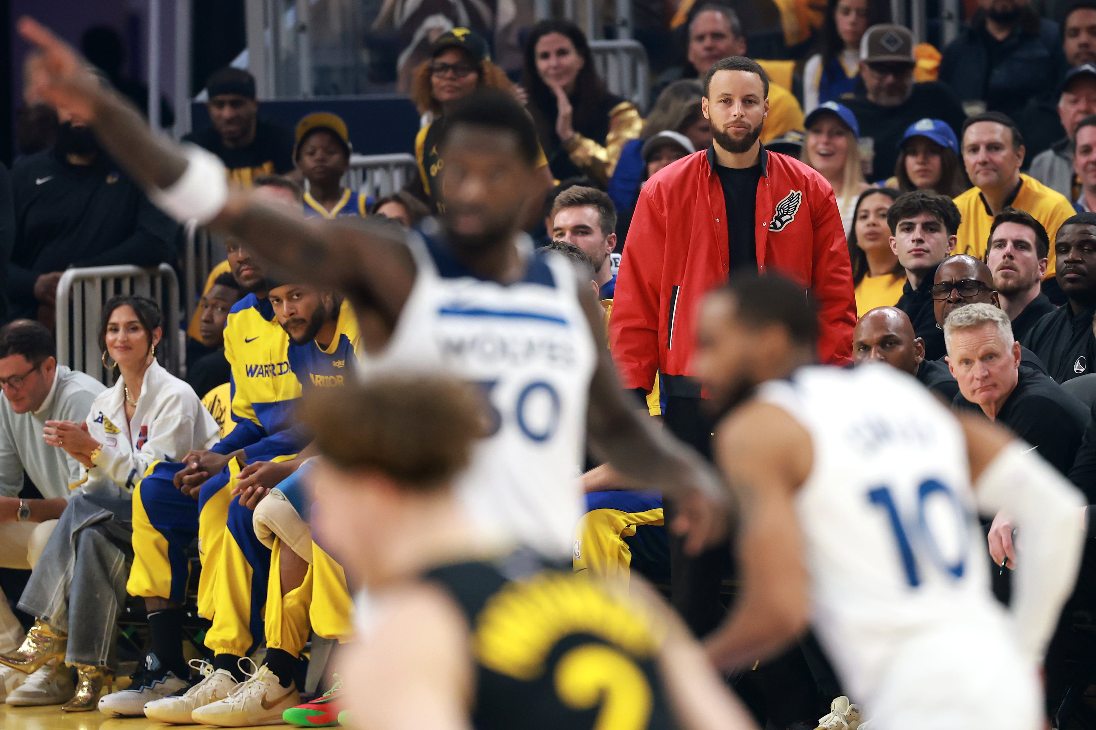 SAN FRANCISCO, CALIFORNIA - MAY 12: Stephen Curry #30 of the Golden State Warriors looks on from the bench during the first quarter against the Minnesota Timberwolves in Game Four of the Western Conference Second Round NBA Playoffs at Chase Center on May 12, 2025 in San Francisco, California. NOTE TO USER: User expressly acknowledges and agrees that, by downloading and or using this photograph, User is consenting to the terms and conditions of the Getty Images License Agreement. (Photo by Ezra Shaw/Getty Images)