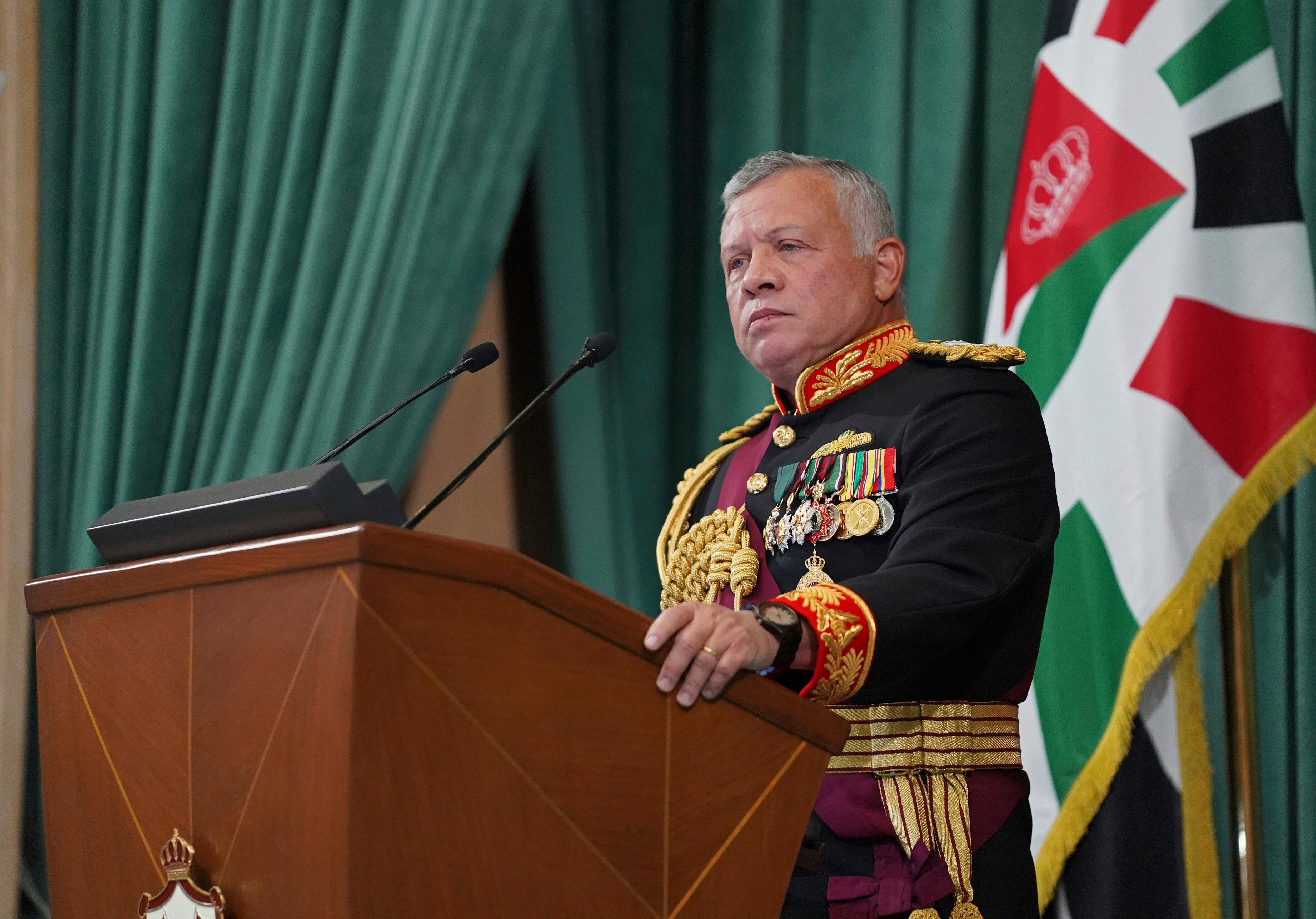 FILE - In this Dec. 10, 2020  photo released by the Royal Hashemite Court, Jordan's King Abdullah II gives a speech during the inauguration of the 19th Parliament's non-ordinary session, in Amman Jordan.  Jordan’s army chief of staff says the half-brother of King Abdullah II was asked to “stop some movements and activities that are being used to target Jordan’s security and stability.” The army chief of staff denied reports Saturday, April 3, 2021, that Prince Hamzah was arrested. He said an investigation is still ongoing and its results will be made public “in a transparent and clear form.”   (Yousef Allan/The Royal Hashemite Court via AP, File)