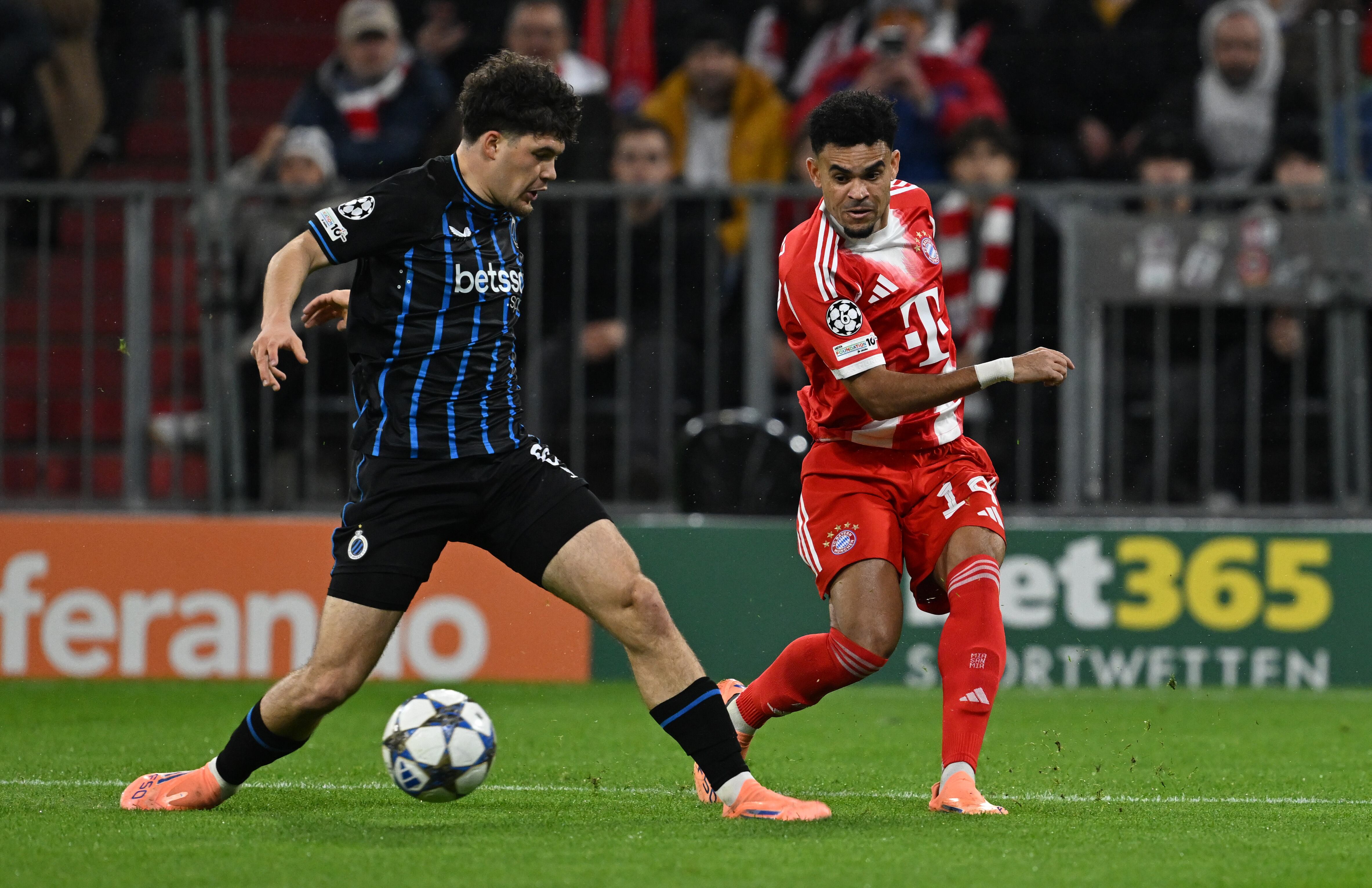 Bruges' Kyriani Sabbe, left, and Bayern Munich's Luis Diaz in action during the Champions League soccer match between Bayern Munich and FC Brugge in Munich, Germany, Wednesday Oct. 22, 2025. (Sven Hoppe/dpa via AP)