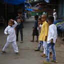 Kids play at a market area during Muslim's Eid-al-Fitr festival marking the end of the holy fasting month of Ramadan under the Covid-19 coronavirus pandemic in the old quarters of New Delhi on May 14, 2021. (Photo by Arun SANKAR / AFP)
