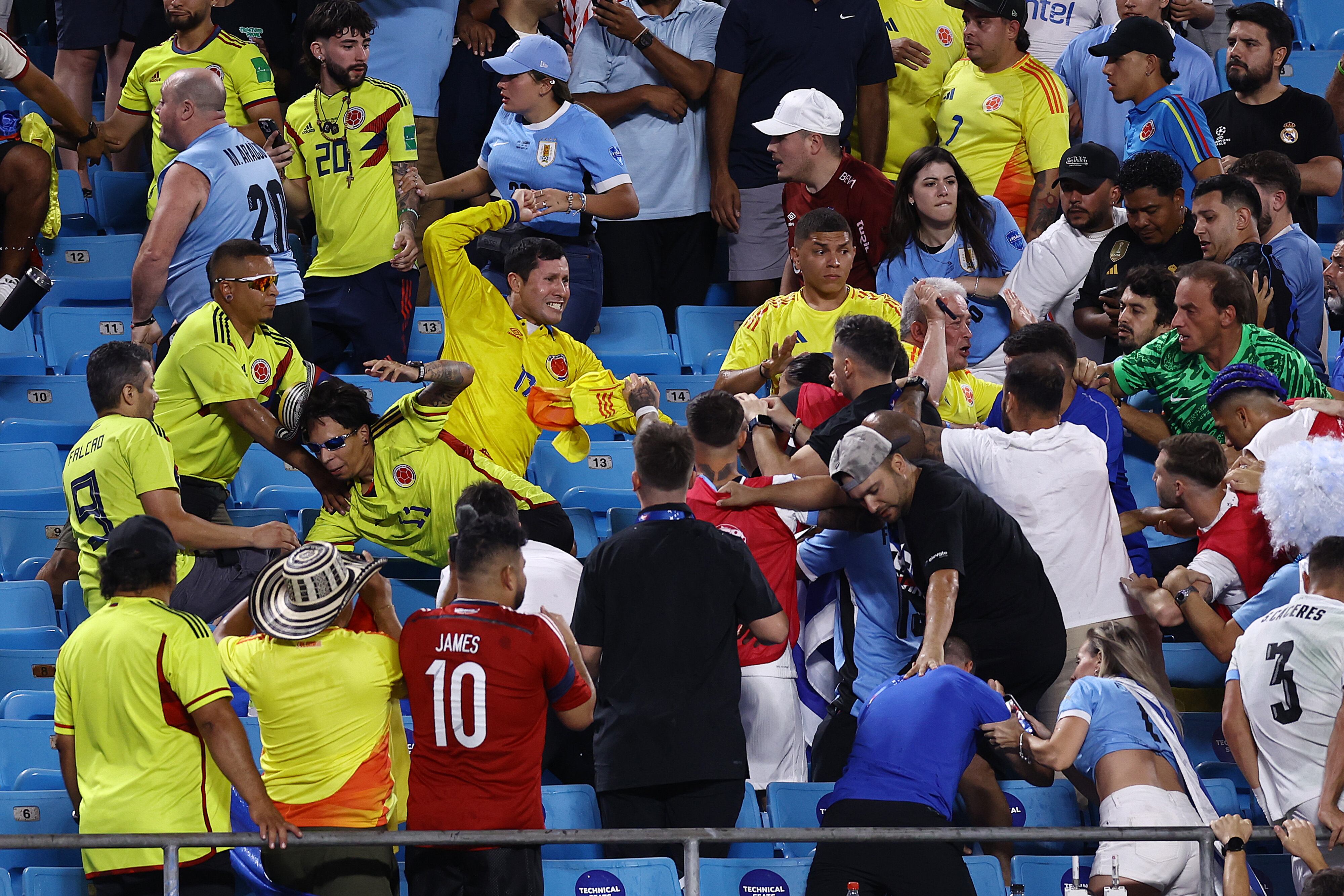 CHARLOTTE, NORTH CAROLINA - JULY 10: Fans of Colombia fight with fans of Uruguay after the CONMEBOL Copa America 2024 semifinal match between Uruguay and Colombia at Bank of America Stadium on July 10, 2024 in Charlotte, North Carolina. (Photo by Tim Nwachukwu/Getty Images)