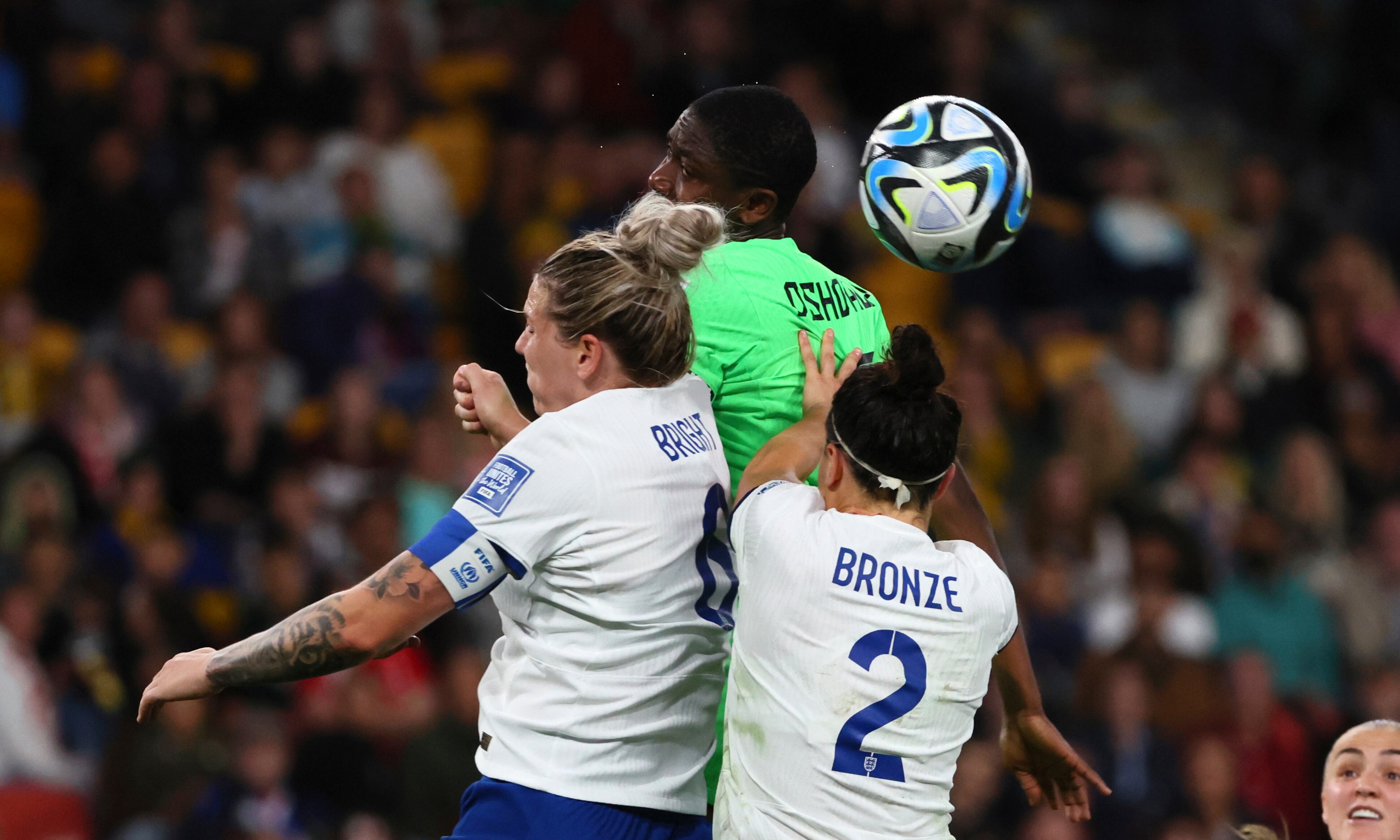 England's Millie Bright, left, Nigeria's Asisat Oshoala, center, and England's Lucy Bronze go for a header during the Women's World Cup round of 16 soccer match between England and Nigeria in Brisbane, Australia, Monday, Aug. 7, 2023. (AP Photo/Tertius Pickard)