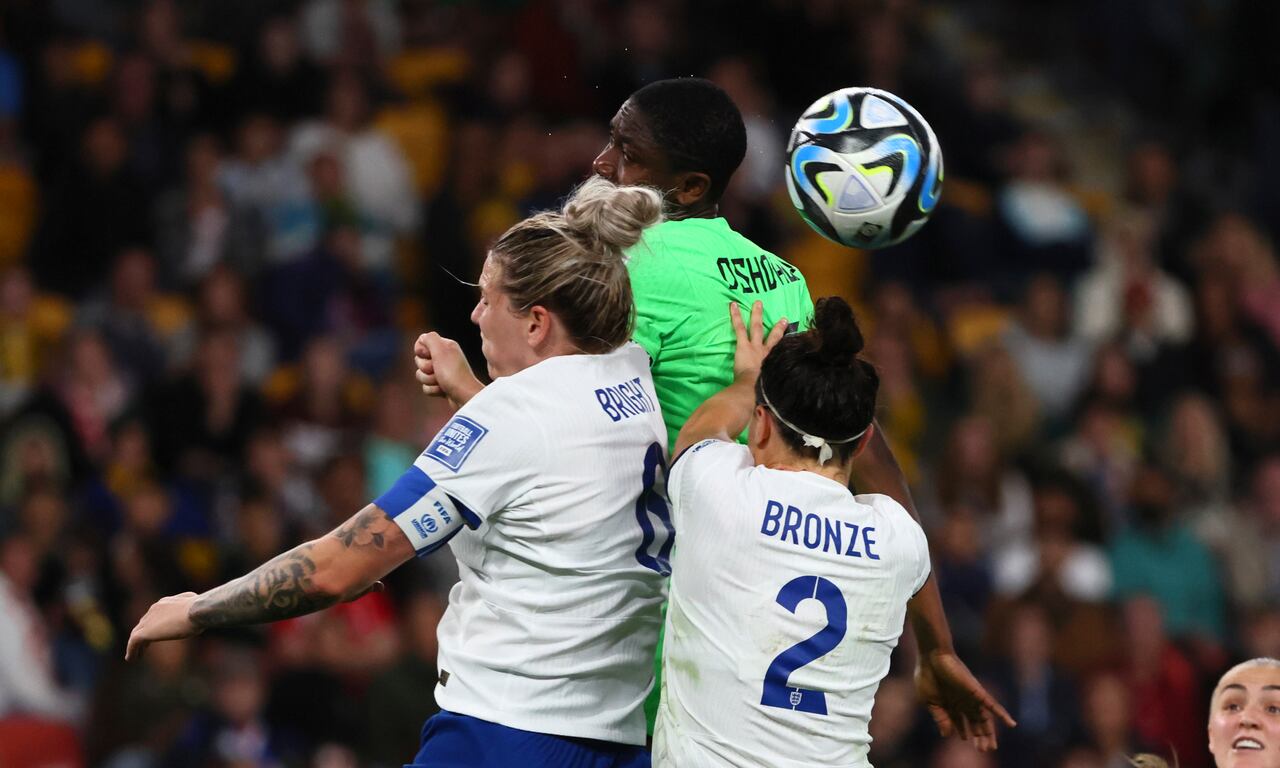 England's Millie Bright, left, Nigeria's Asisat Oshoala, center, and England's Lucy Bronze go for a header during the Women's World Cup round of 16 soccer match between England and Nigeria in Brisbane, Australia, Monday, Aug. 7, 2023. (AP Photo/Tertius Pickard)