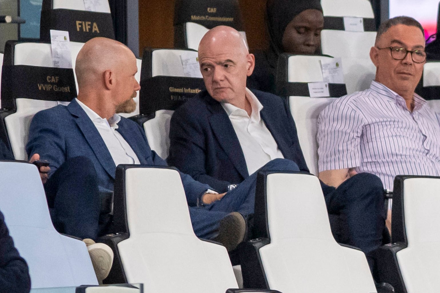 FIFA president Gianni Infantino, center, speaks to FIFA secretary general Mattias Grafstrom, left, sitting beside president of Moroccan Royal Football Federation Fouzi Lekjaa as they attend a Women's AFCON 2026 soccer match between Malawi and Zambia, in Rabat, Morocco, Wednesday, Aug. 5, 2026. (AP Photo)