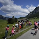 The pack rides during the ninth stage of the Tour de France cycling race over 193 kilometers (119.9 miles) with start in Aigle, Switzerland and finish in Chatel les Portes du Soleil, France, Sunday, July 10, 2022. (AP/Thibault Camus)