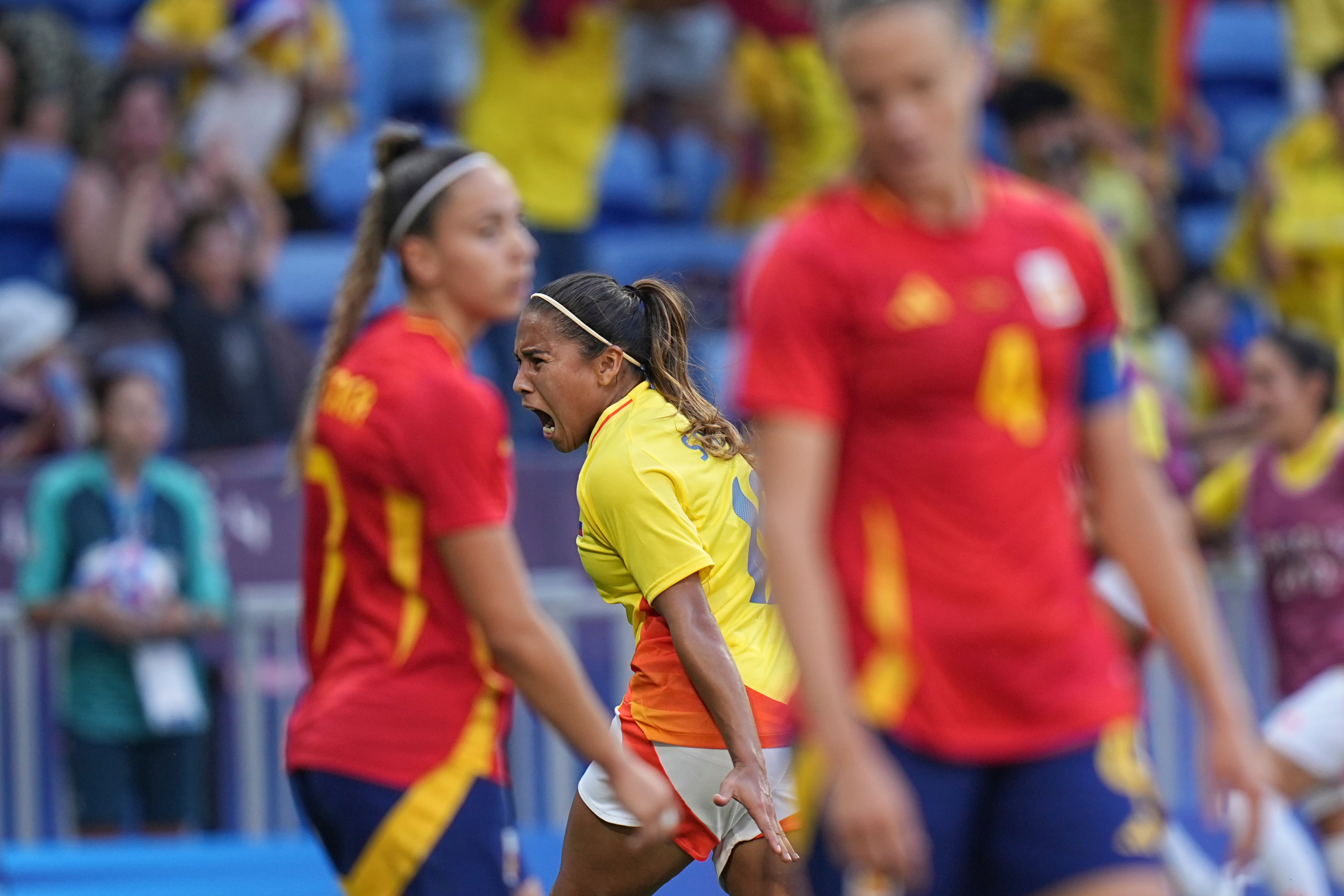 Colombia's Leicy Santos celebrates after scoring her side's 2nd goal during the women's quarter-final soccer match between Spain and Colombia, at Lyon Stadium, during the 2024 Summer Olympics, Saturday, Aug. 3, 2024, in Decines, France. (AP Photo/Laurent Cipriani)