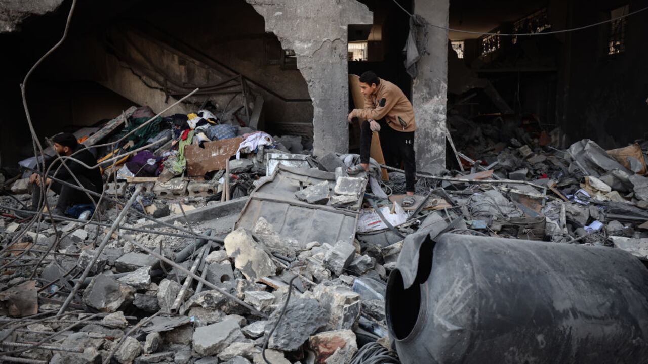 People look through the rubble in a house after an Israeli strike in Gaza City on March 18, 2025. Israel on March 18 unleashed its most intense campaign on the Gaza Strip since a January ceasefire, with Gaza civil defence agency saying 220 people killed, prompting Hamas to accuse Benjamin Netanyahu's government of torpedoing the truce. (Photo by Majdi Fathi/NurPhoto via Getty Images)