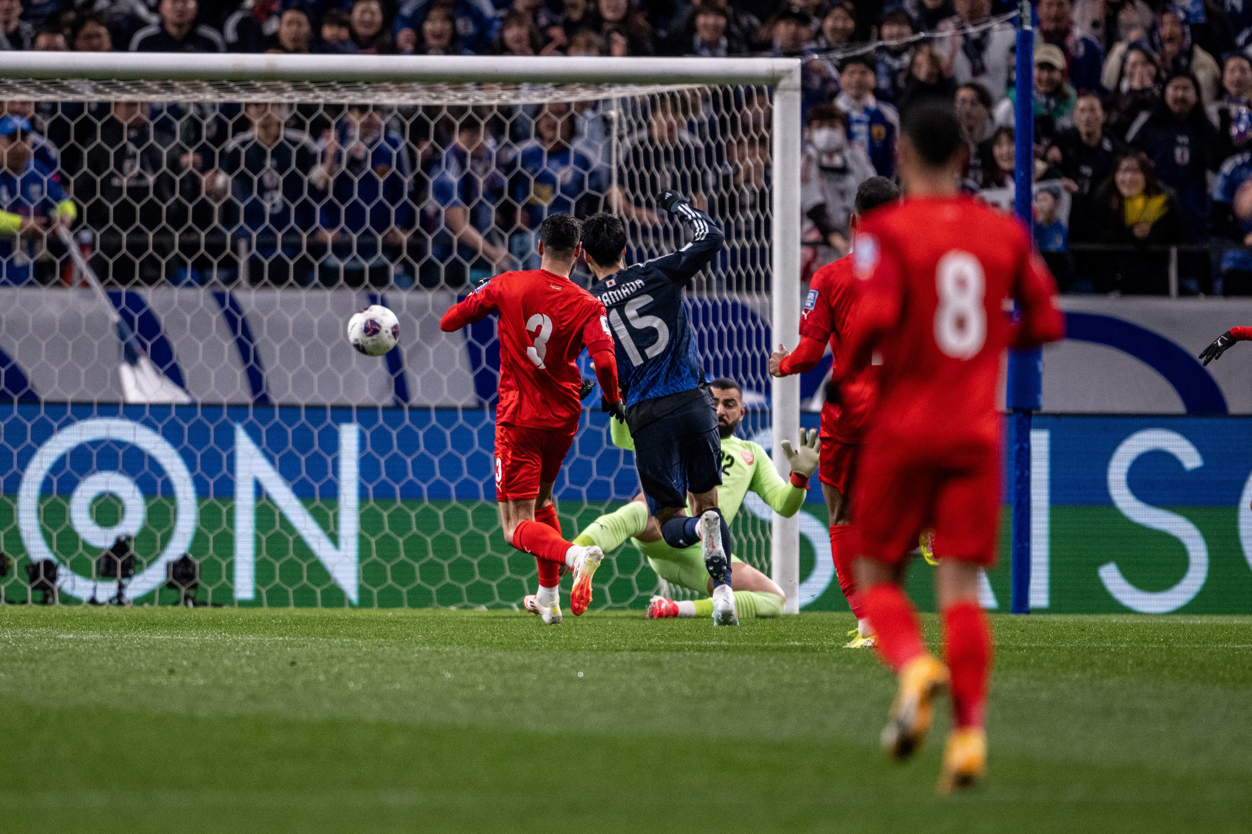 Japan's Daichi Kamada (#15) scores the goal during the 2026 FIFA World Cup Asian qualification football match between Japan and Bahrain in Saitama on March 20, 2025. (Photo by Philip FONG / AFP)