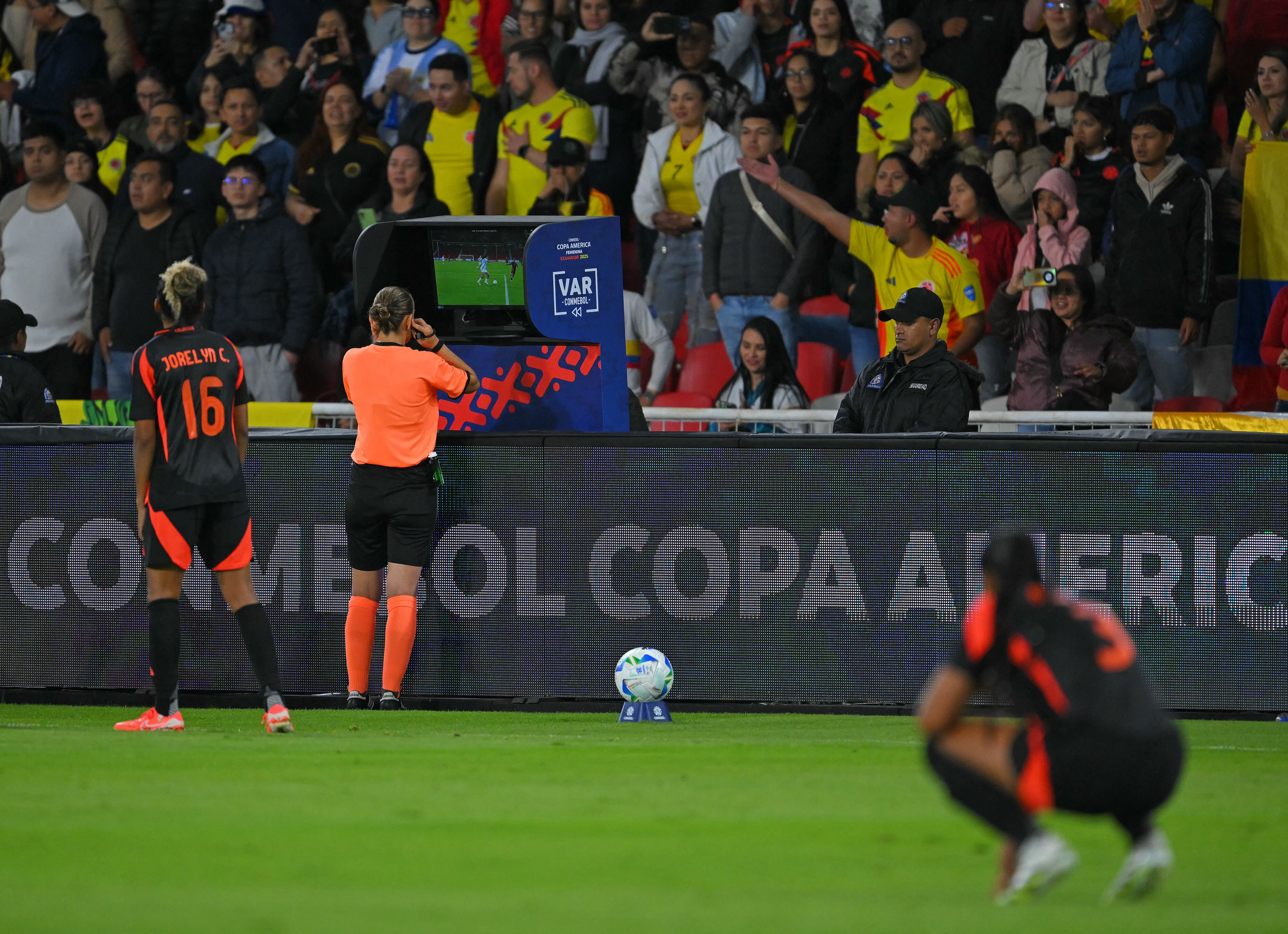 Macedonian referee Ivana Projkovska checks a possible penalty during the Women's Copa America 2025 semifinal football match between Argentina and Colombia at the Rodrigo Paz Delgado Stadium in Quito on July 28, 2025. (Photo by Rodrigo BUENDIA / AFP)