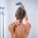 PRODUCTION - 20 September 2022, Berlin: ILLUSTRATION - A woman standing in the shower at home (posed scene). For many people, the daily shower is part of their daily routine - for personal hygiene, but also as a feel-good ritual that they don't like to be interfered with. (to dpa "Warm or cold, short or long? - When showering becomes a statement") Photo: Annette Riedl/dpa (Photo by Annette Riedl/picture alliance via Getty Images)